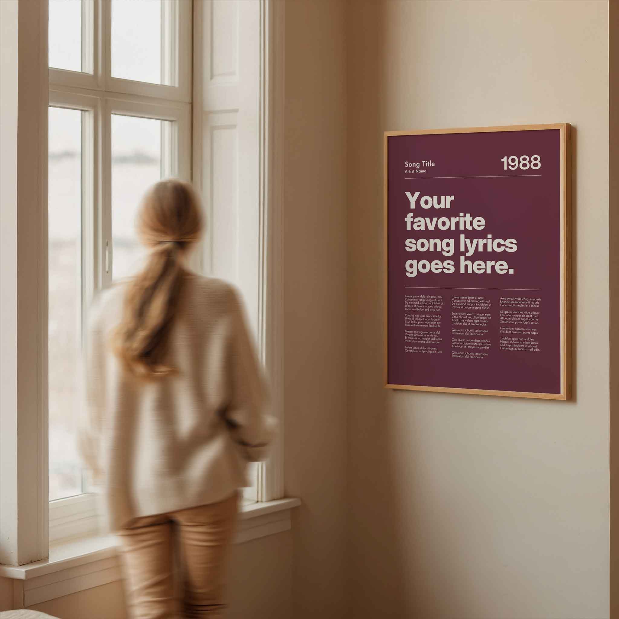 a woman looking out a window at a poster