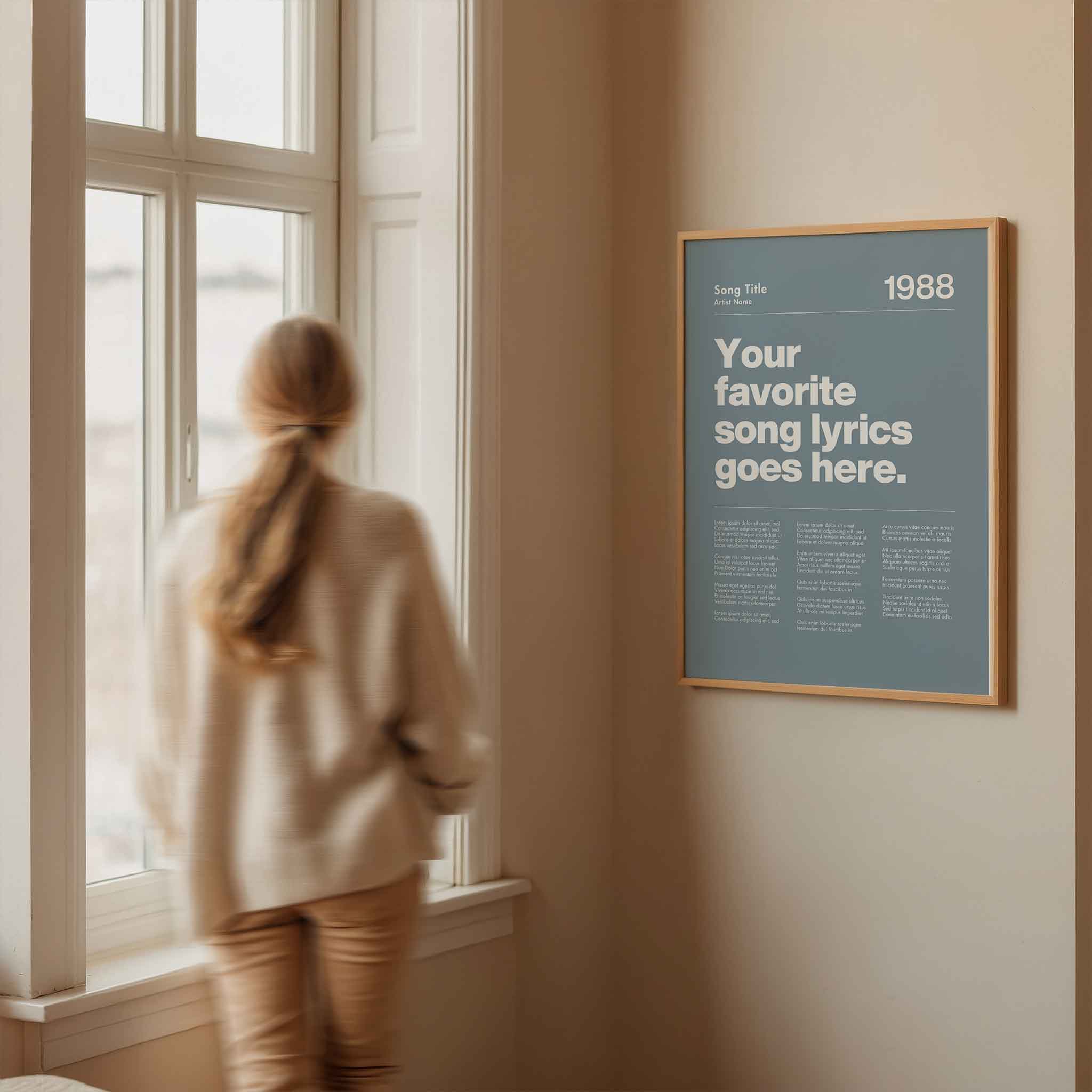 a woman looking out a window at a poster