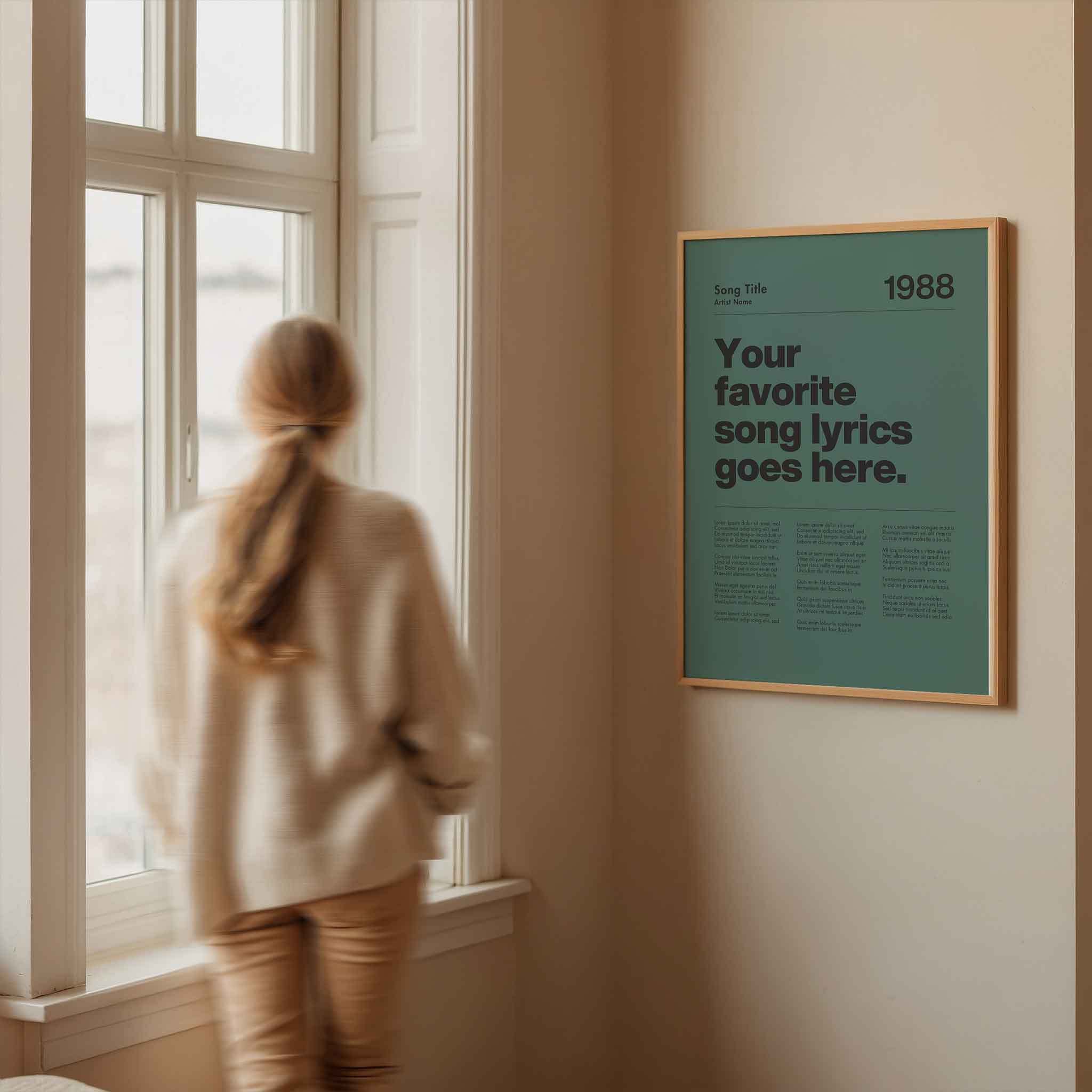a woman looking out a window at a poster