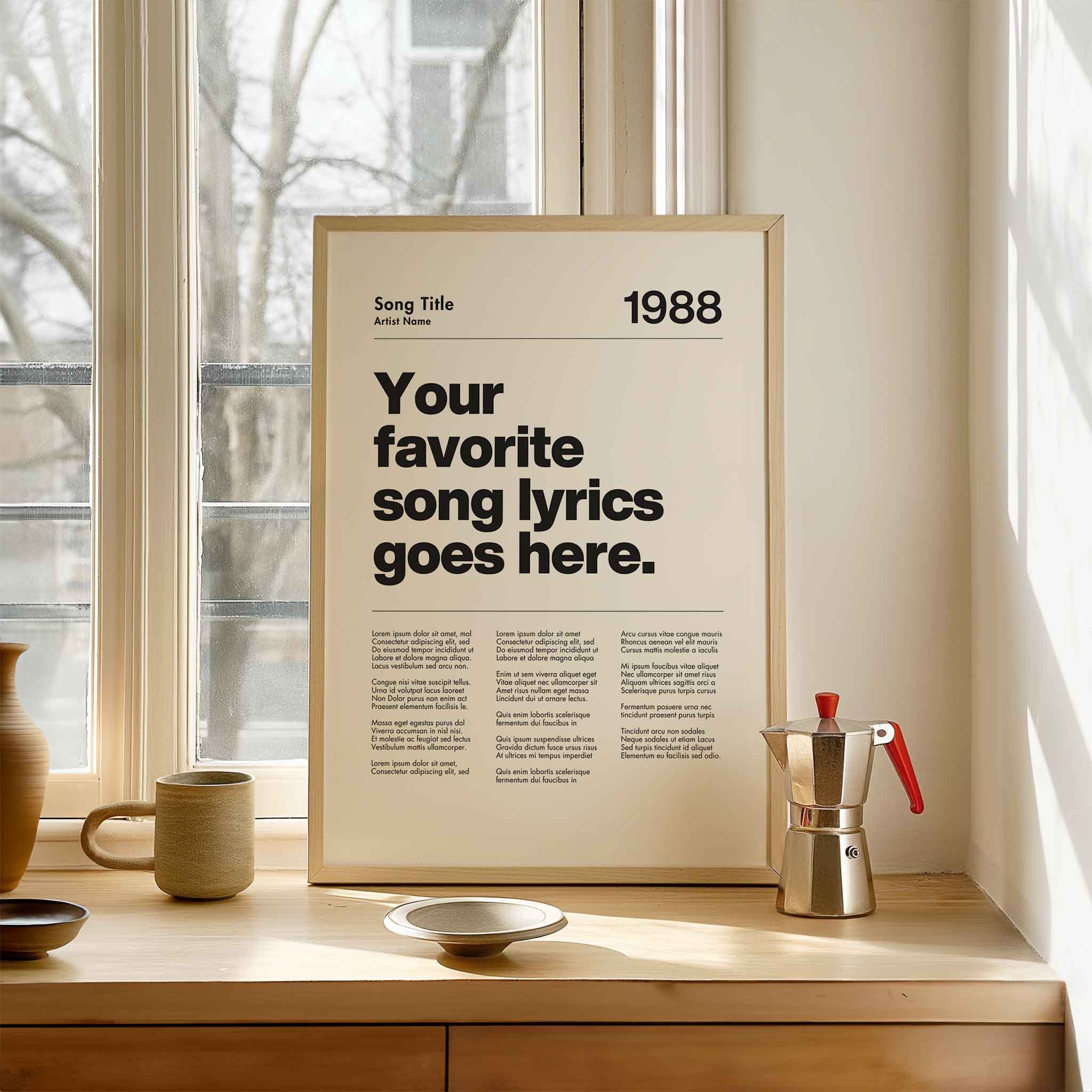a poster on a window sill next to a cup and saucer