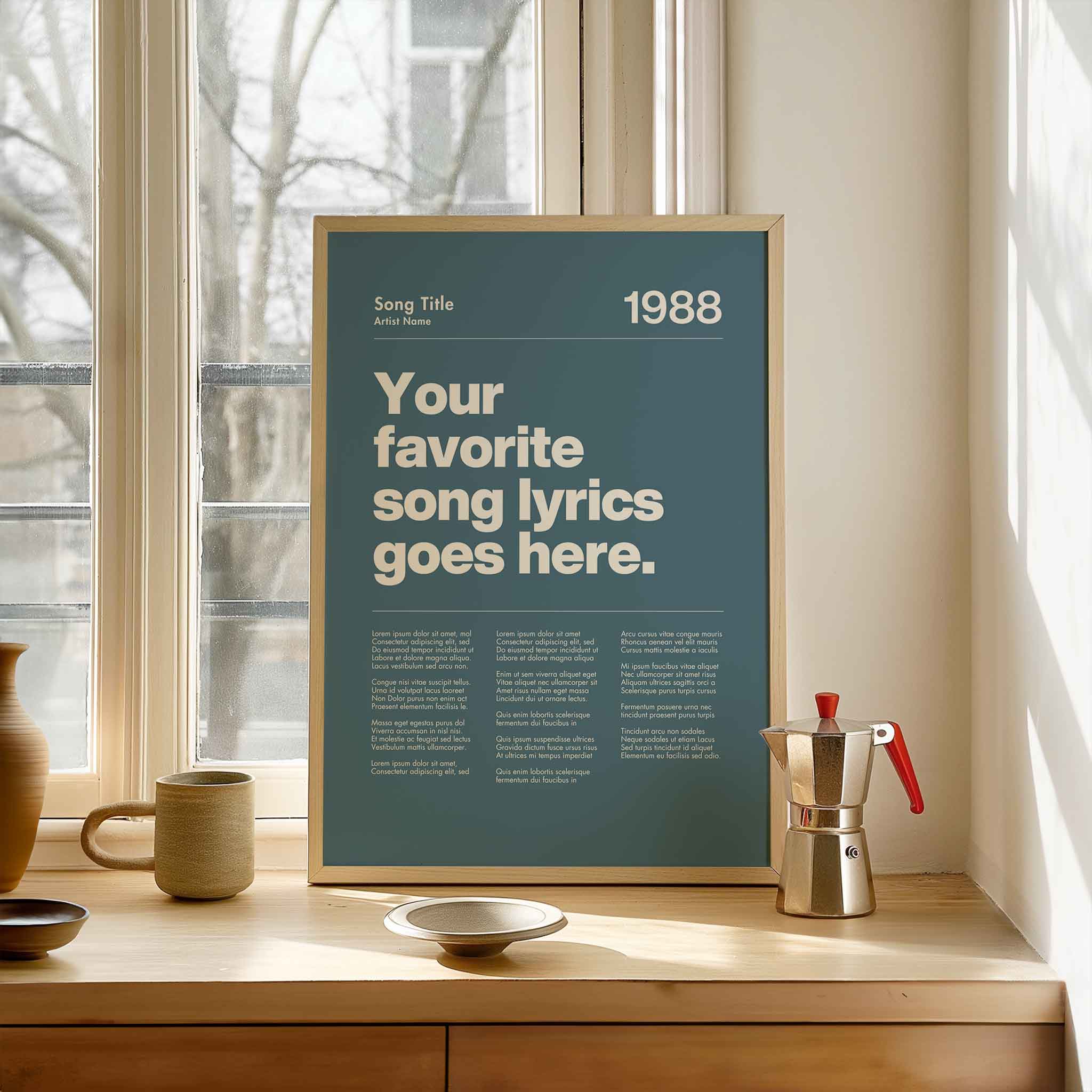 a poster on a window sill next to a cup and saucer