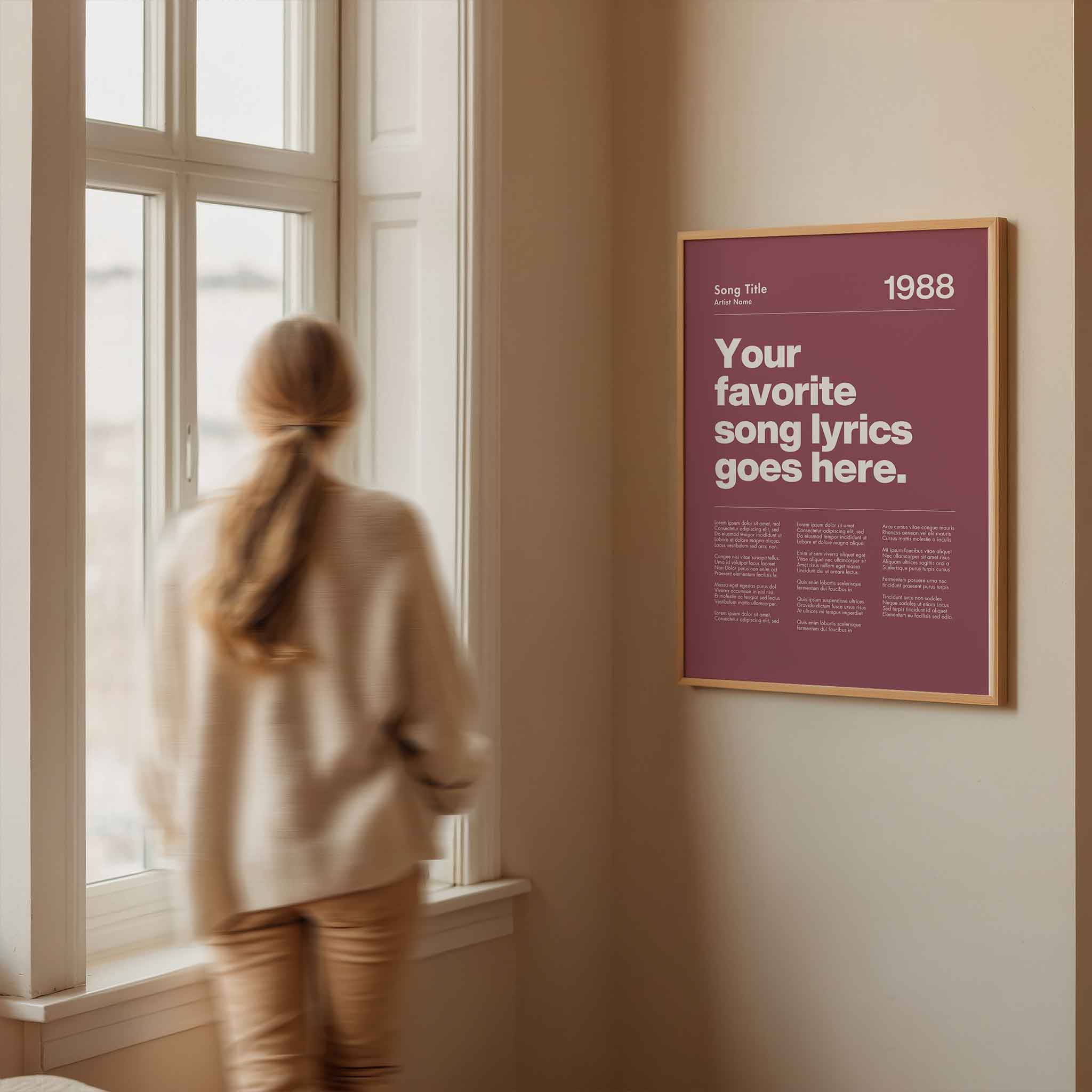 a woman looking out a window at a poster