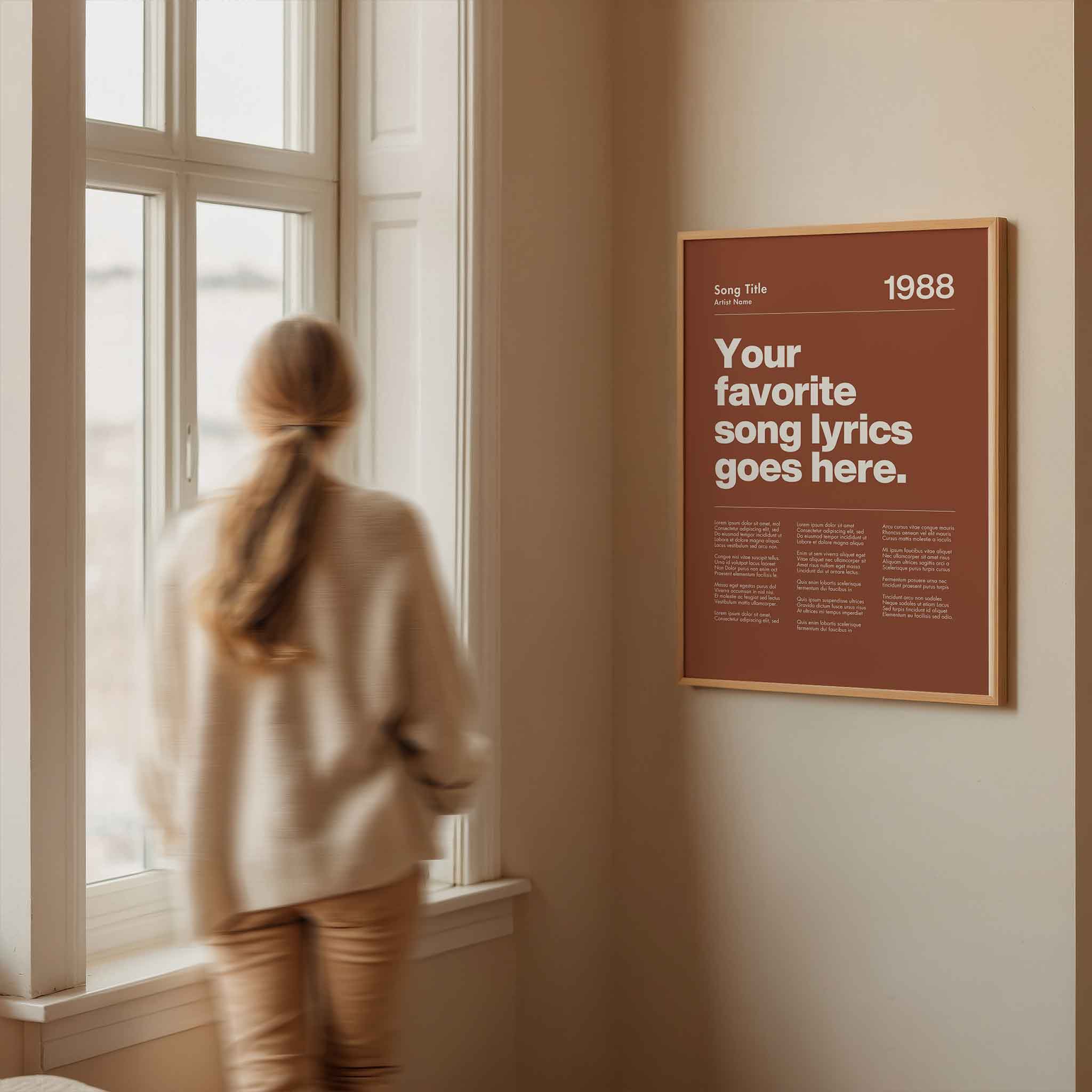 a woman looking out a window at a poster