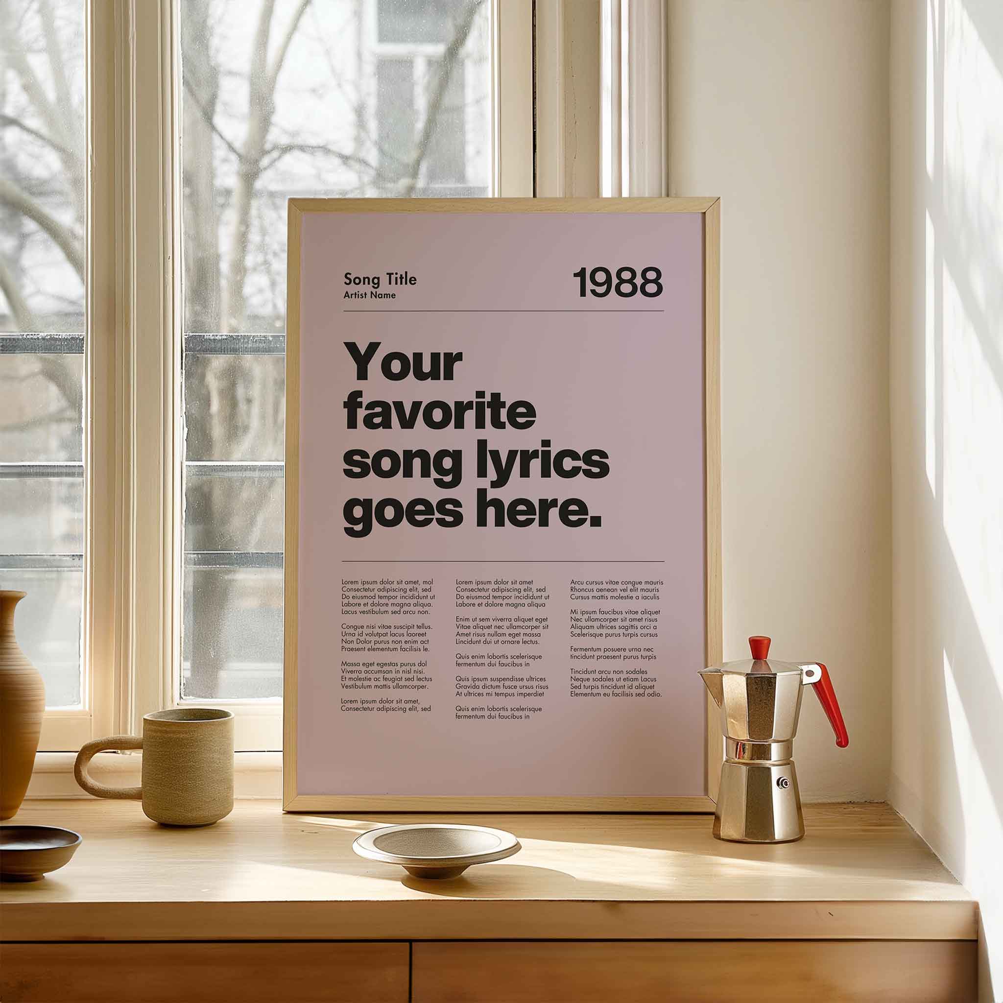 a poster sitting on a window sill next to a cup and saucer