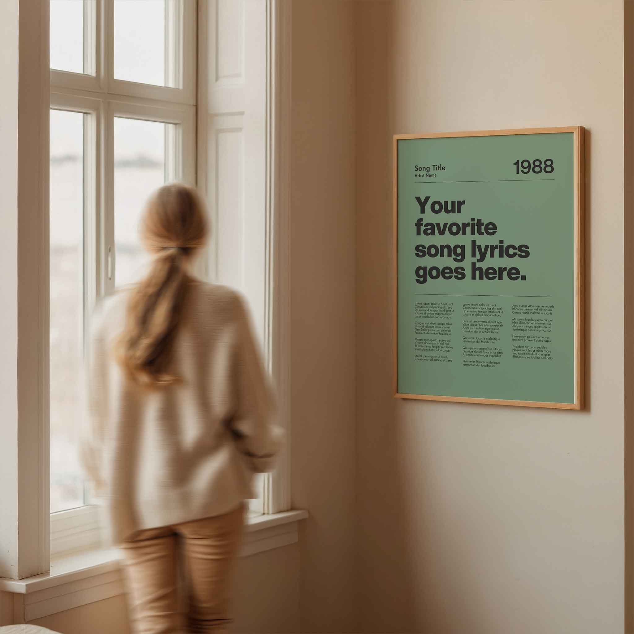 a woman looking out a window at a poster