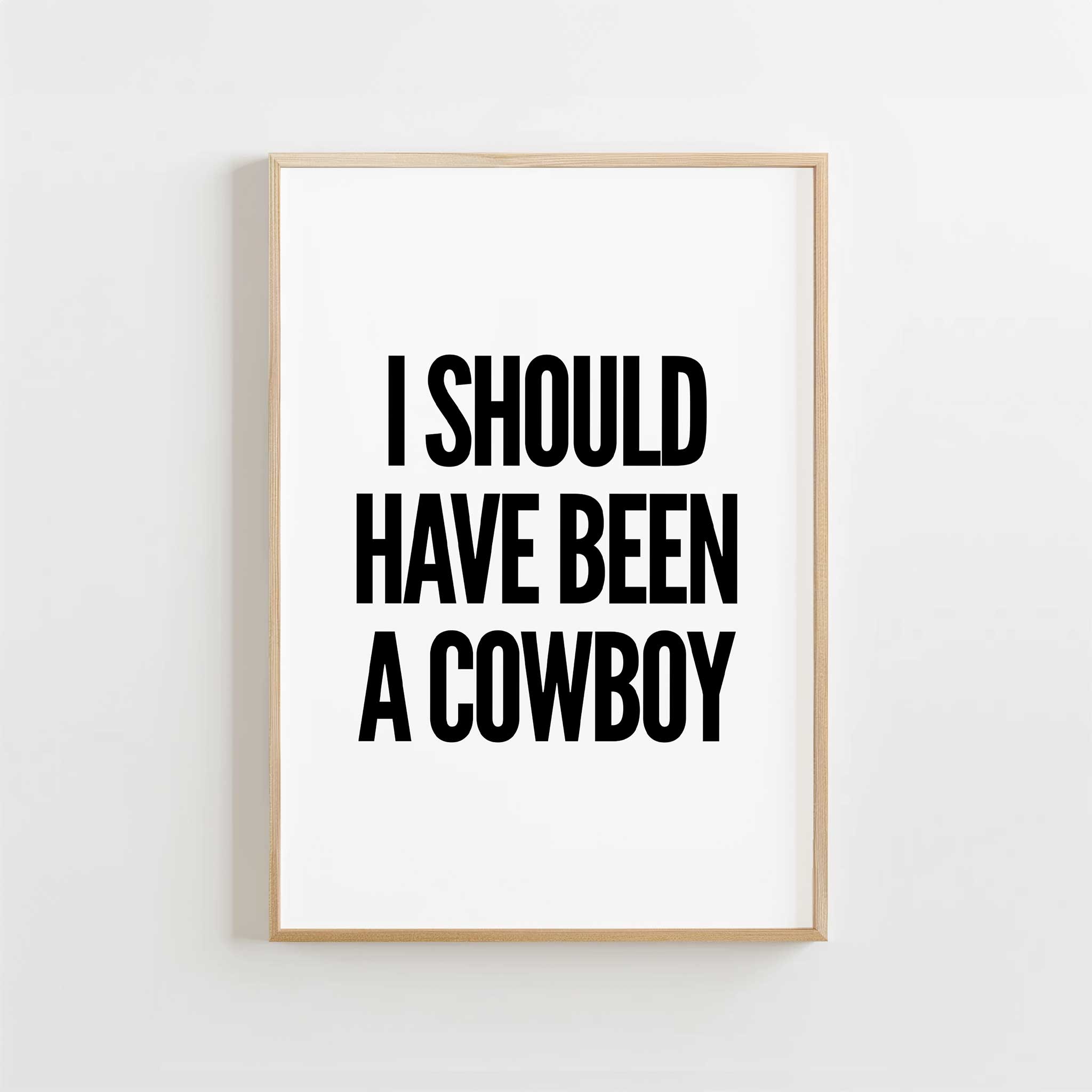 I Should Have Been a Cowboy' western typography, minimalist wall art for a fun aesthetic, titled 'I Should Have Been a Cowboy'