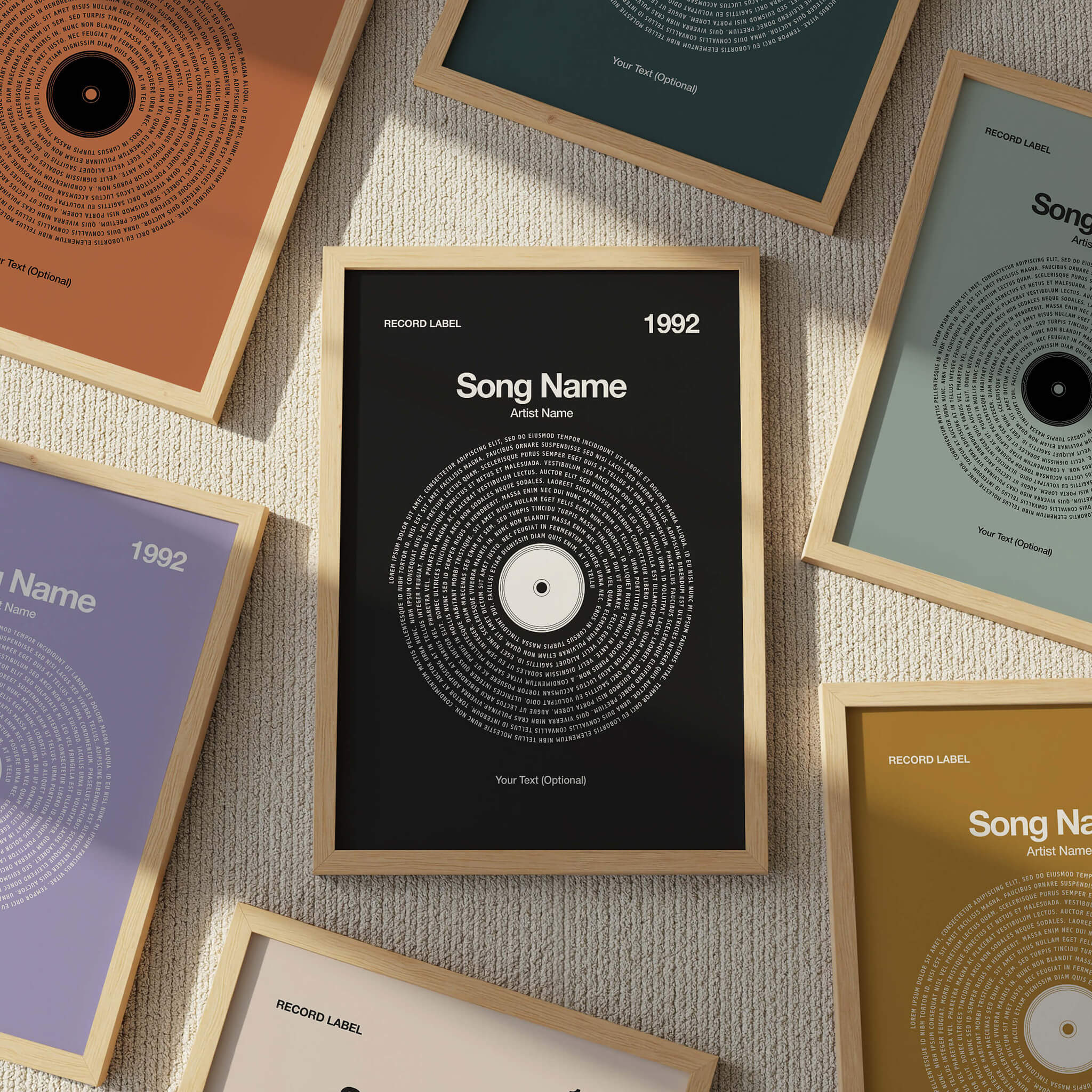Framed vinyl record art prints on a textured surface