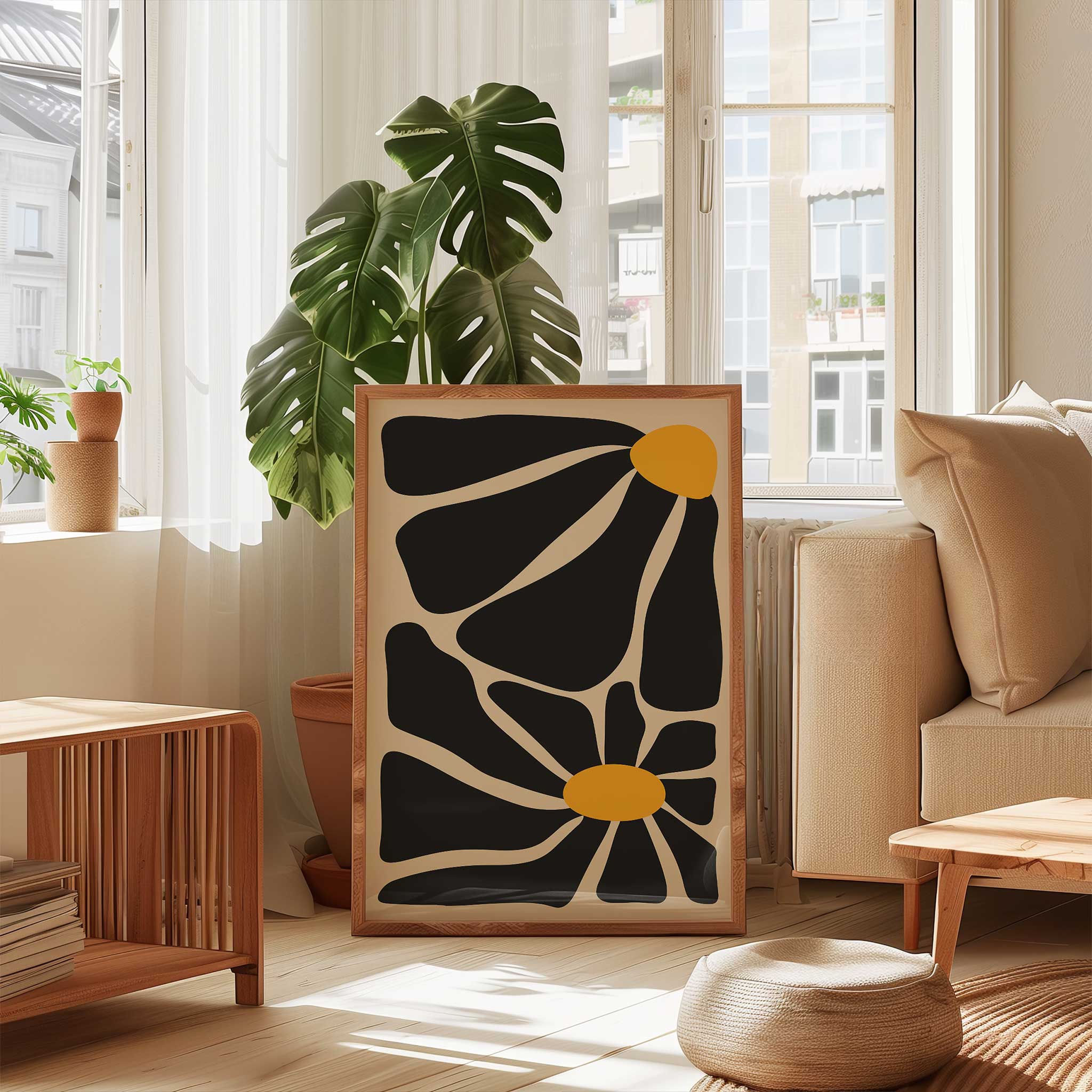 A bold, contemporary abstract print of two flowers with oversized black petals and vivid golden centers.