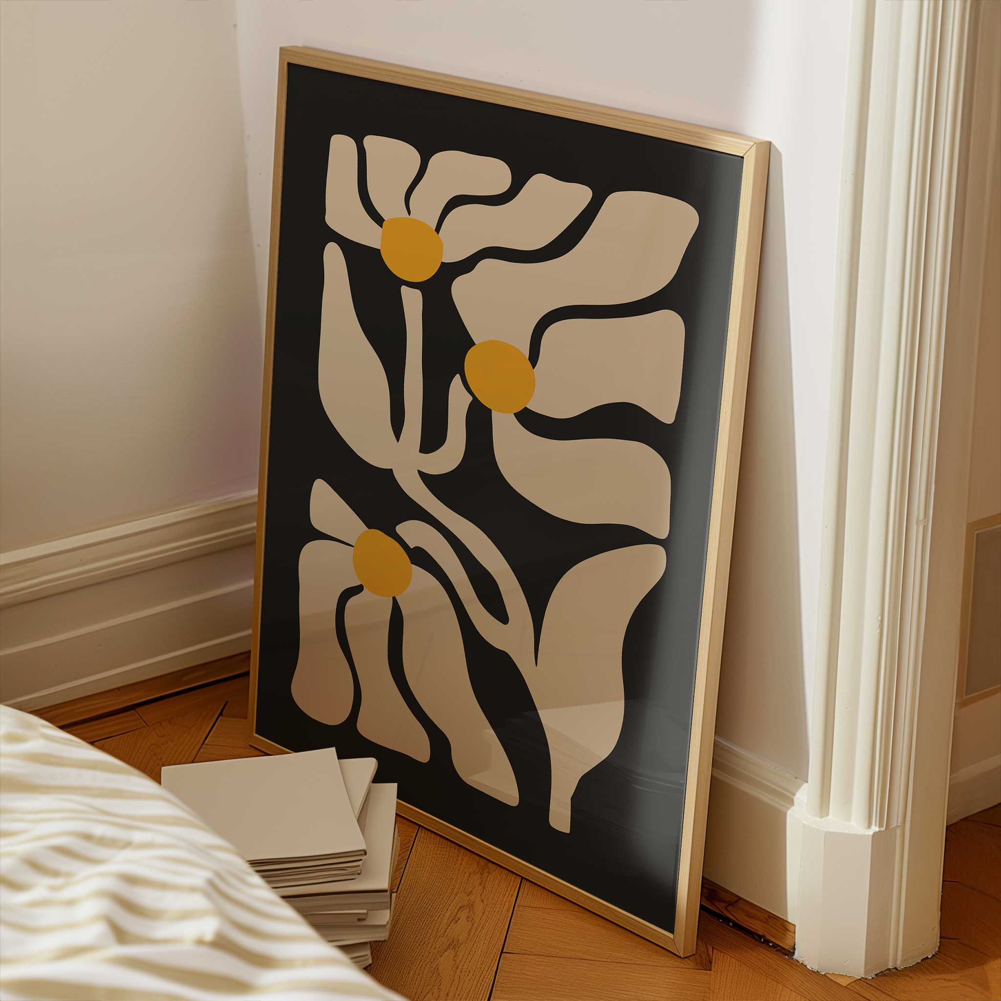 Three abstract golden floral shapes glowing against a deep black background, a high-contrast botanical print.