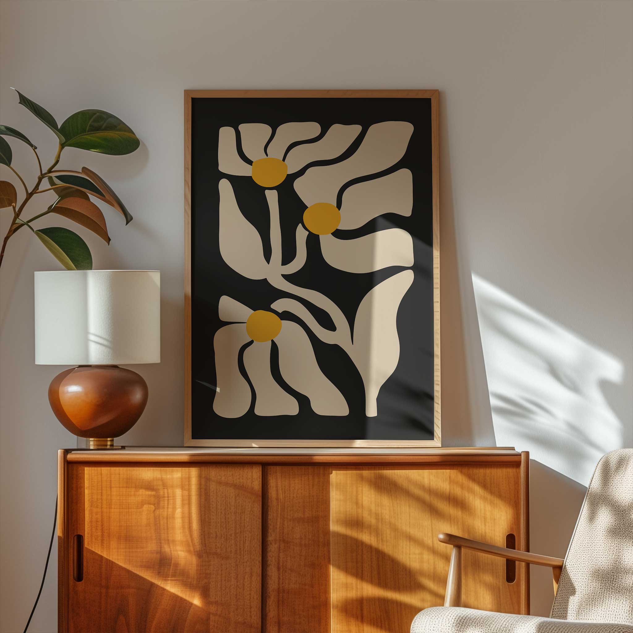 Three abstract golden floral shapes glowing against a deep black background, a high-contrast botanical print.