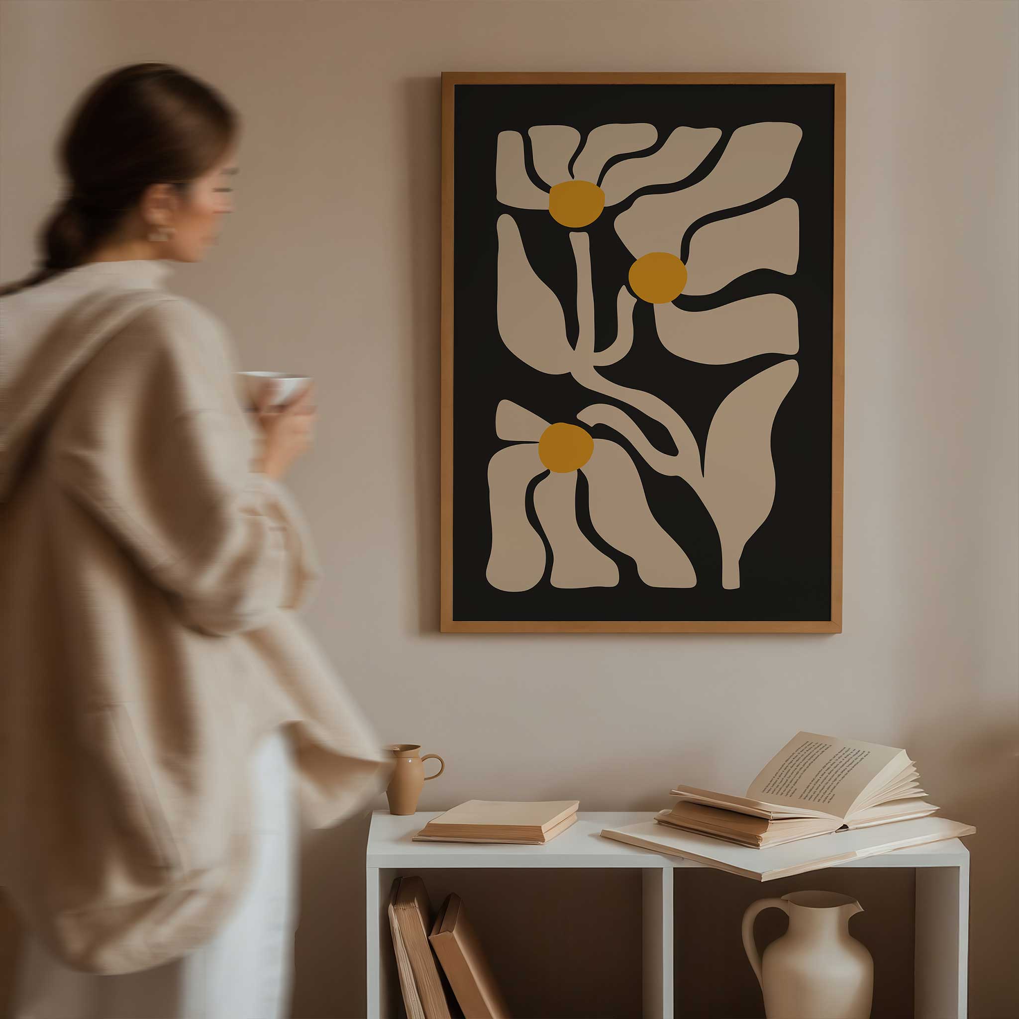 Three abstract golden floral shapes glowing against a deep black background, a high-contrast botanical print.