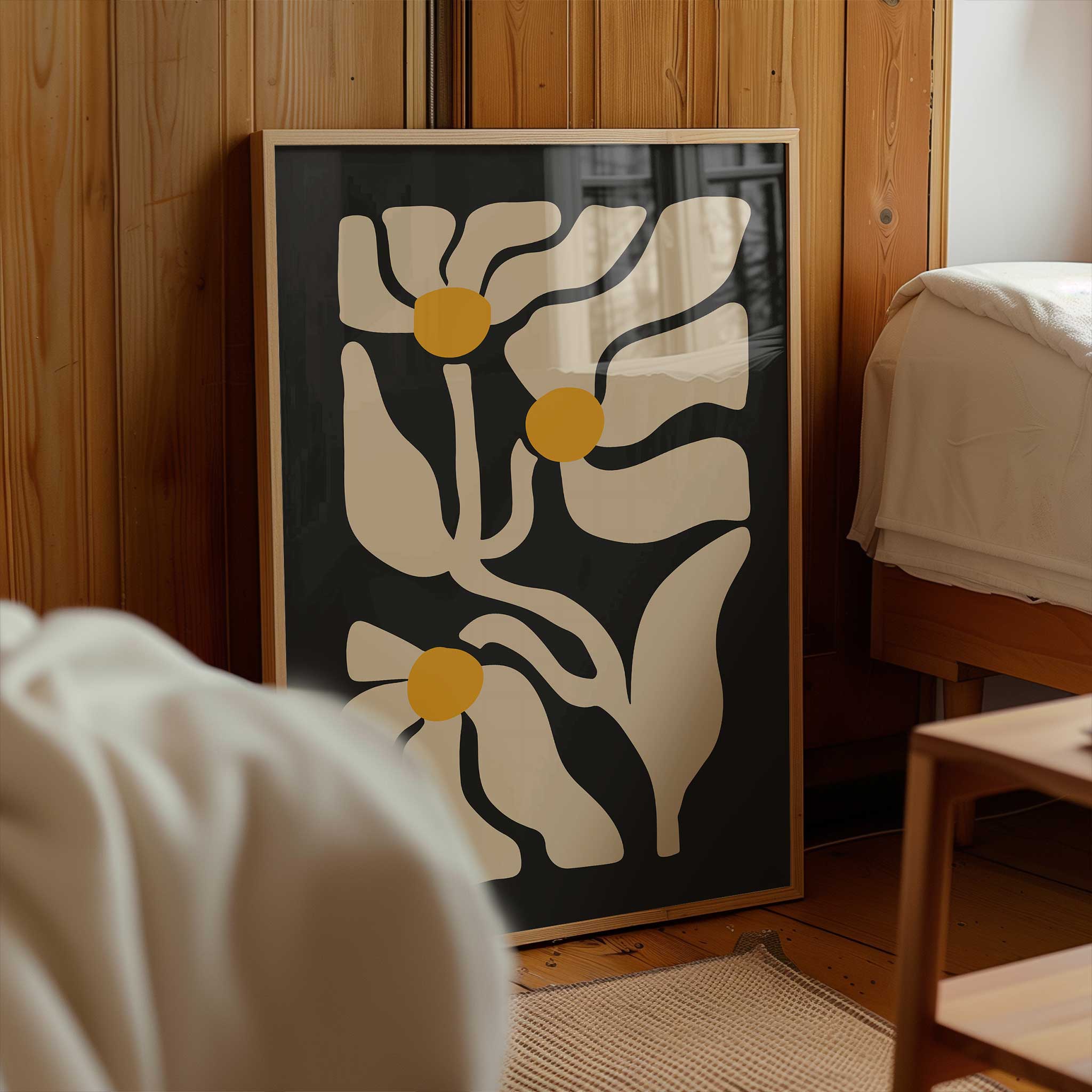Three abstract golden floral shapes glowing against a deep black background, a high-contrast botanical print.