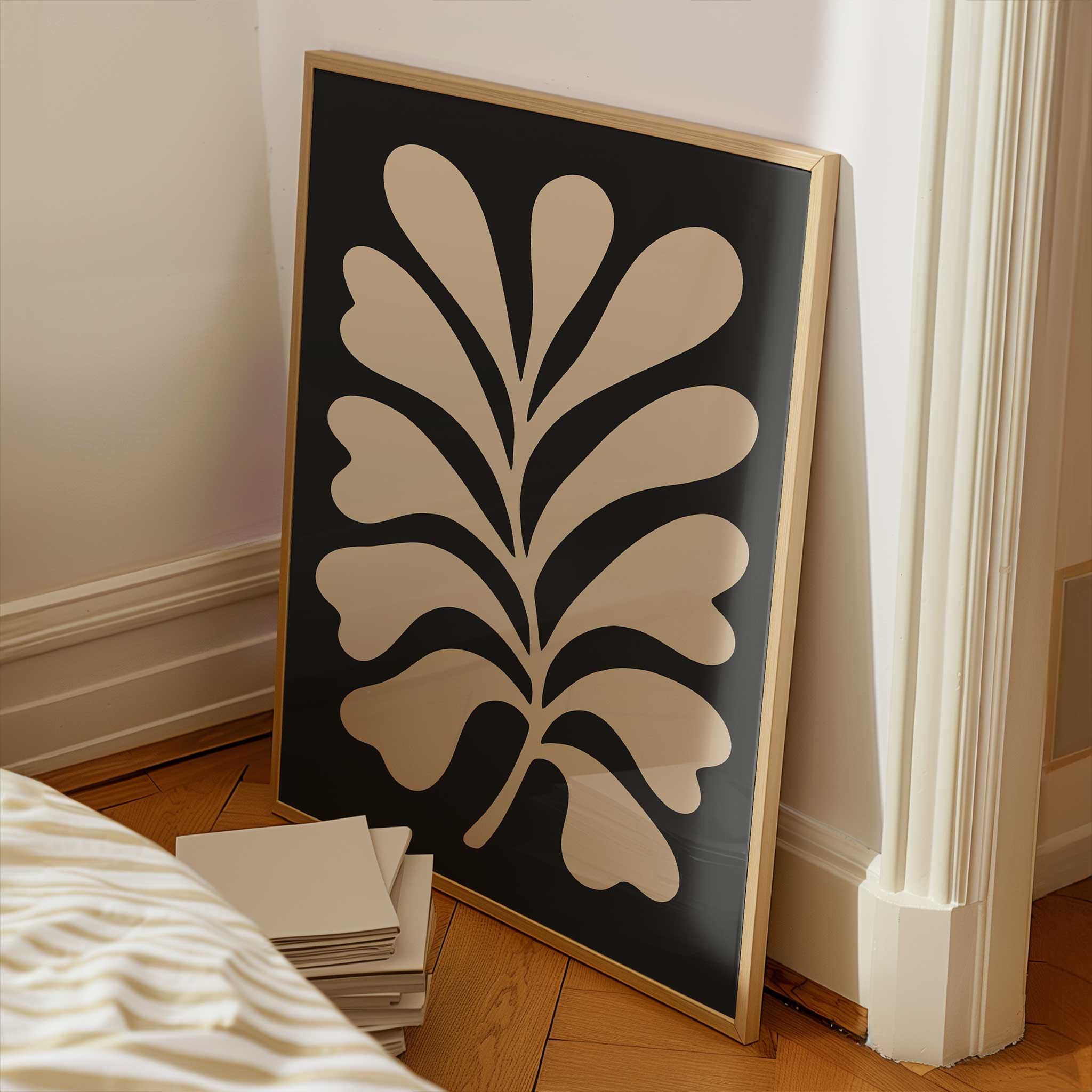 A clean, minimalist silhouette of a light-colored fern against a solid black background.