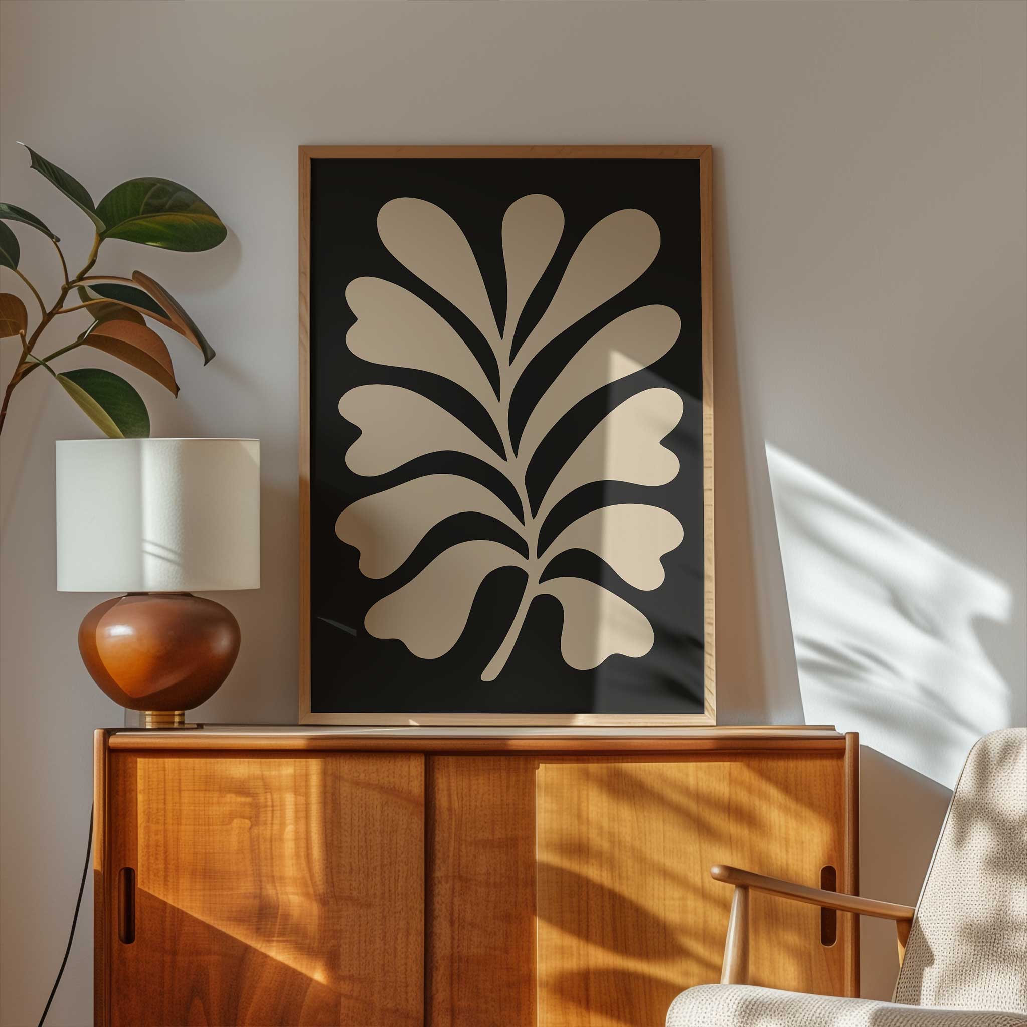 A clean, minimalist silhouette of a light-colored fern against a solid black background.