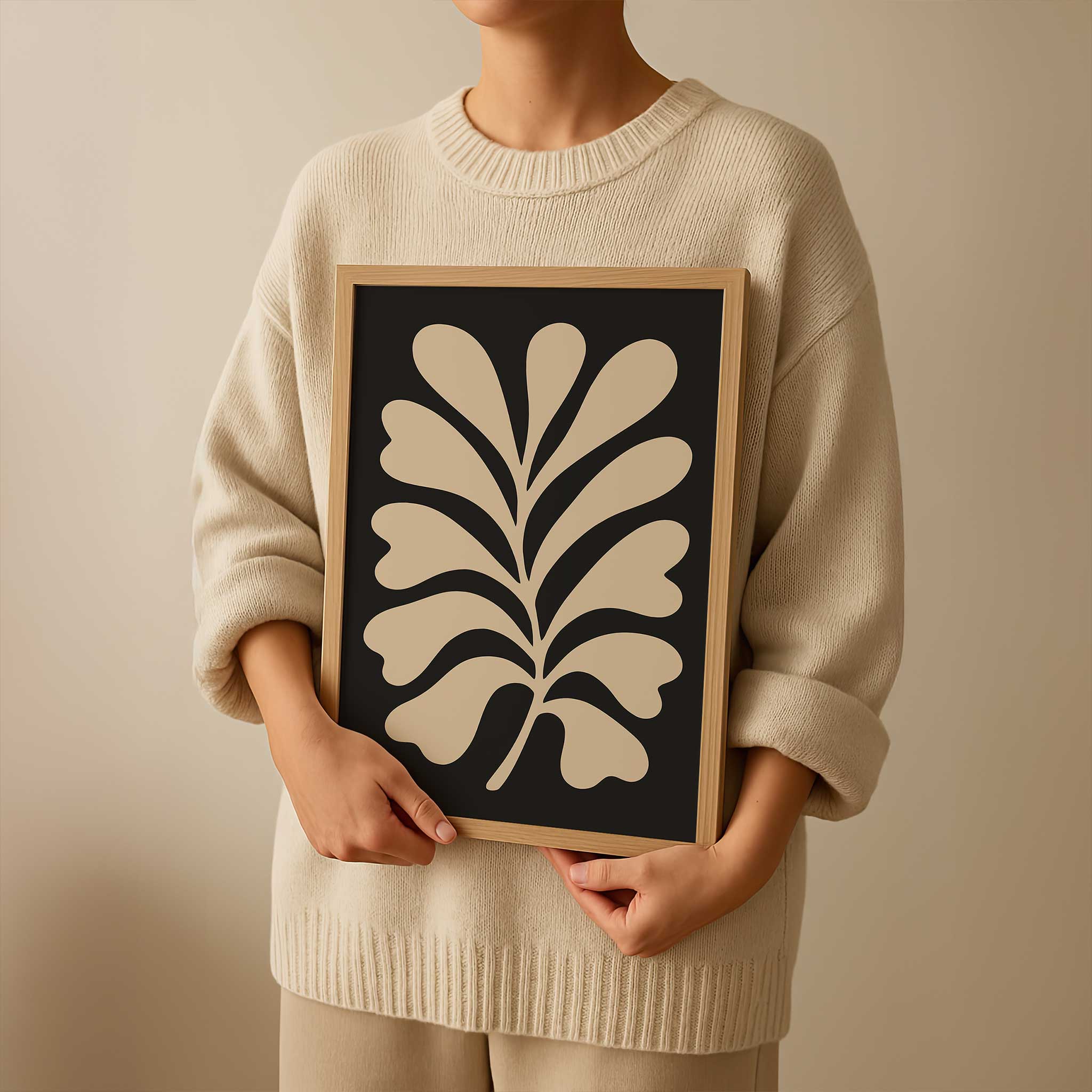 A clean, minimalist silhouette of a light-colored fern against a solid black background.