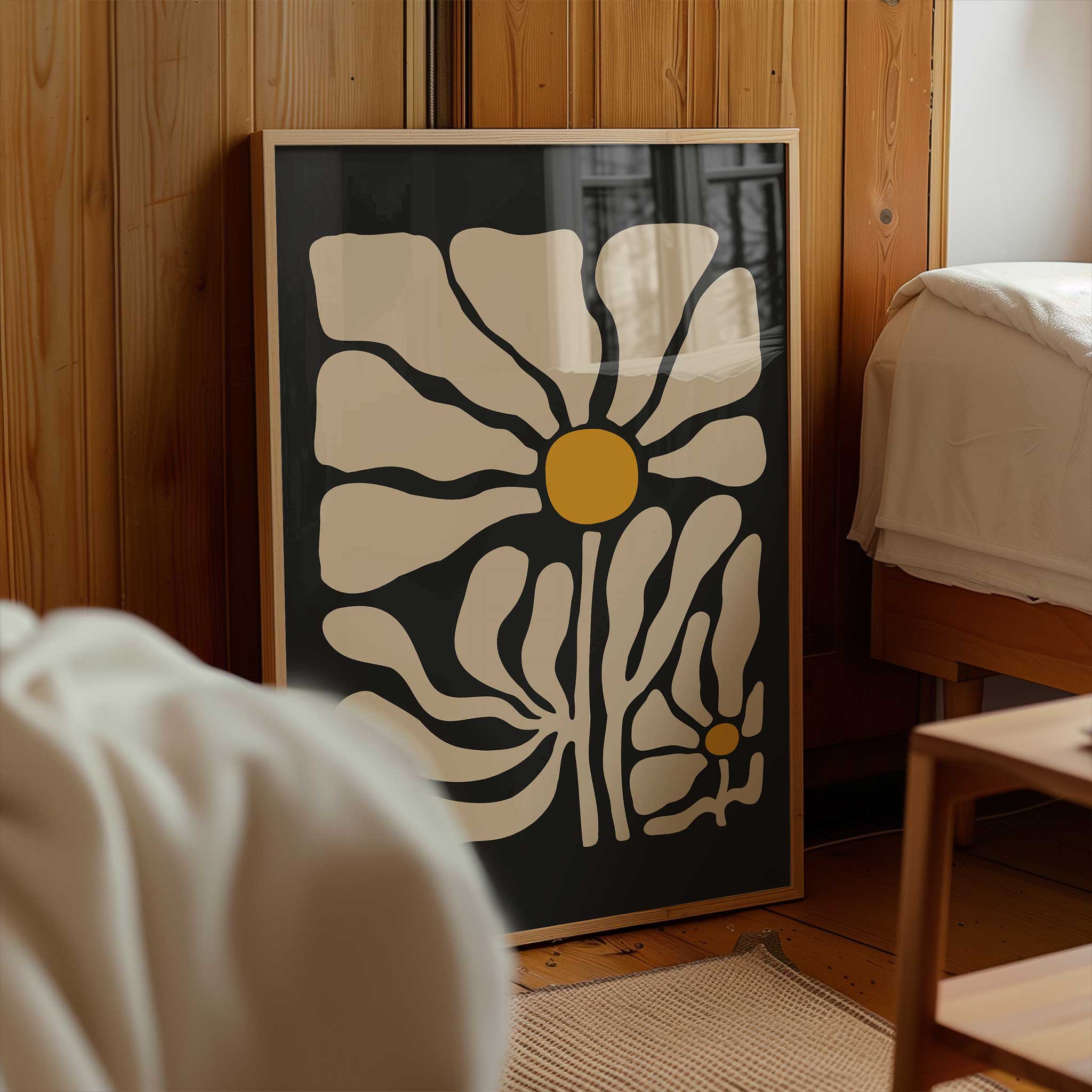 A striking, modern floral poster of a single chamomile bloom with fluid lines and bold contrast.