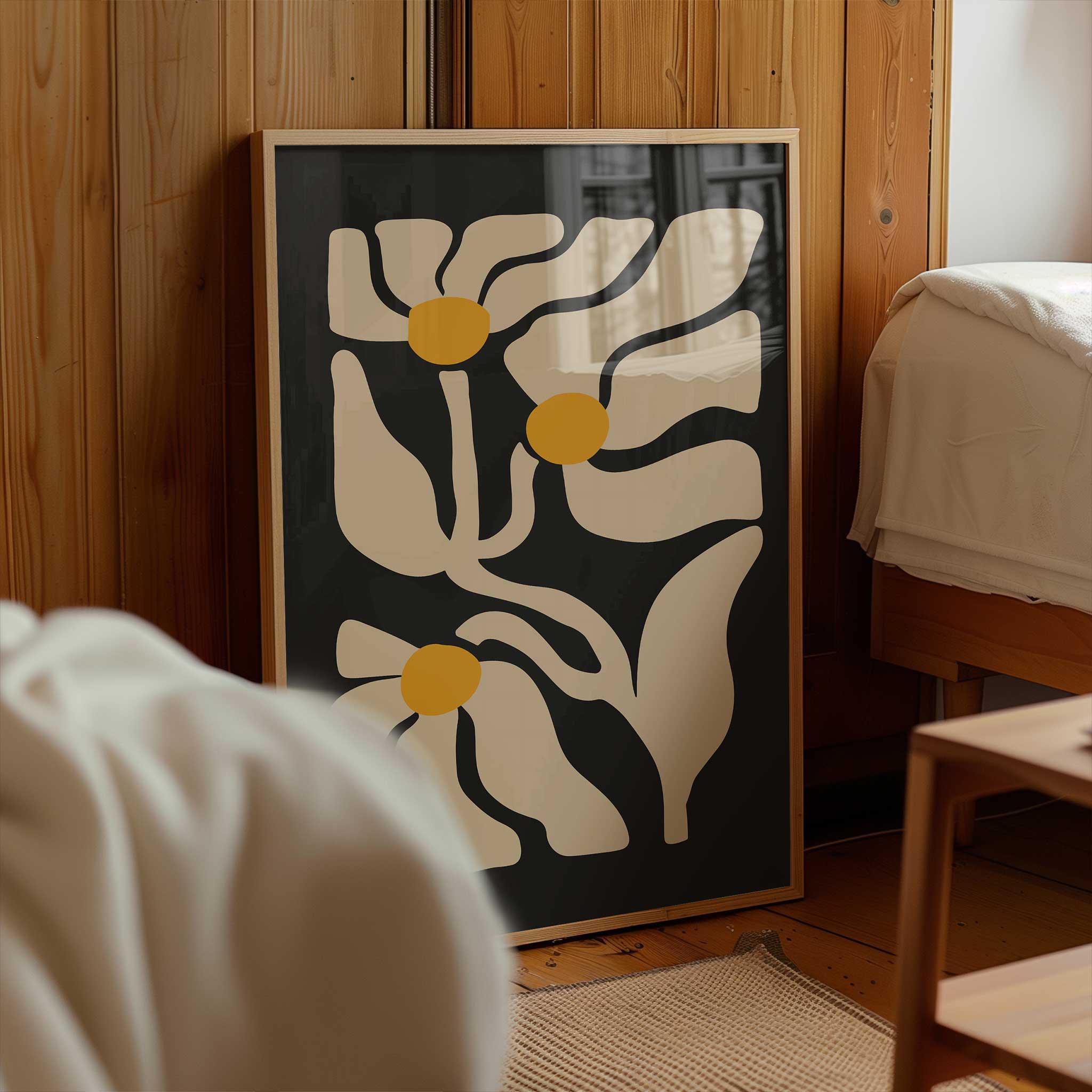 A playful retro print of three daisies with flowing lines and sunny yellow centers.