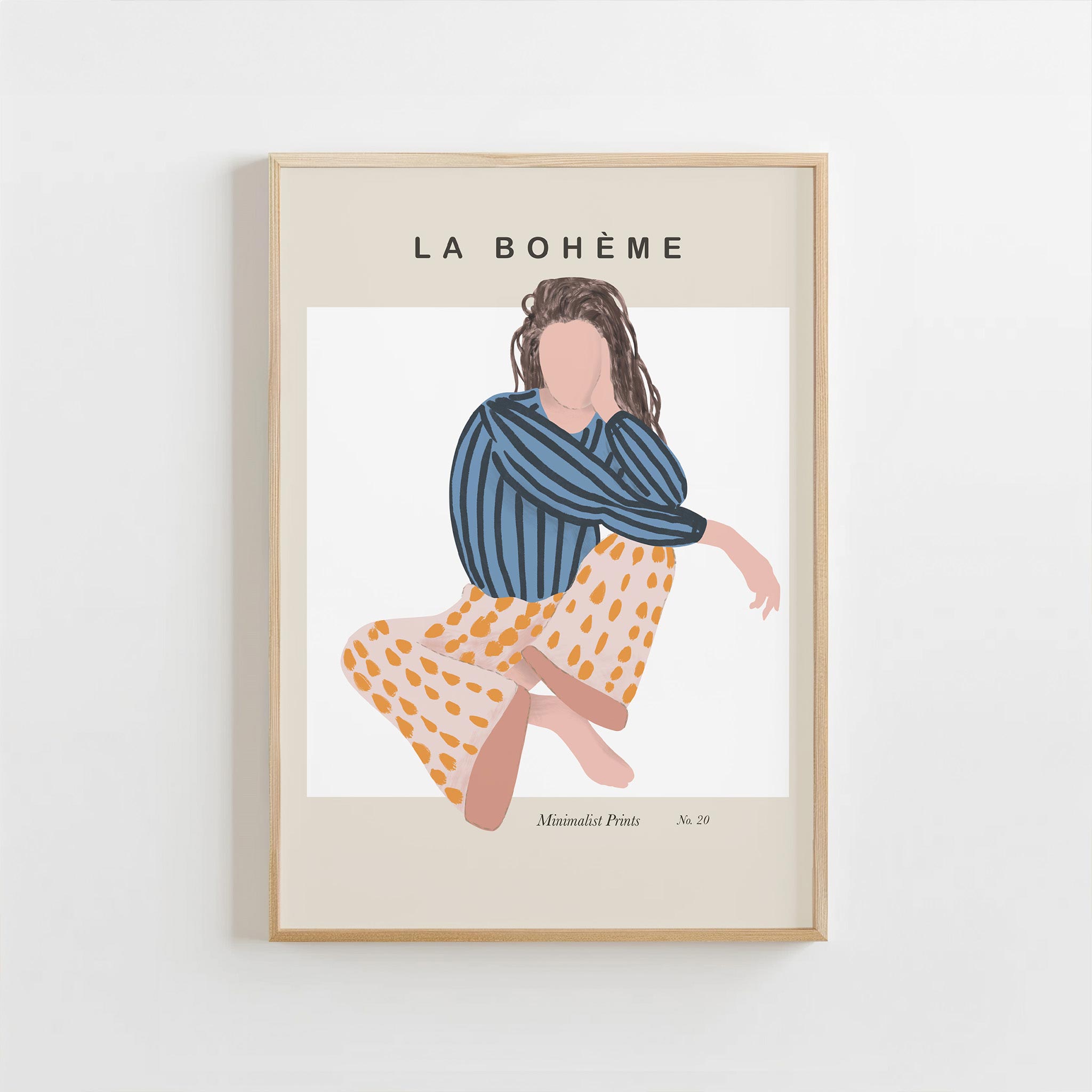 Framed artwork of a woman in a blue top and patterned skirt with 'La Bohème' text on a white background