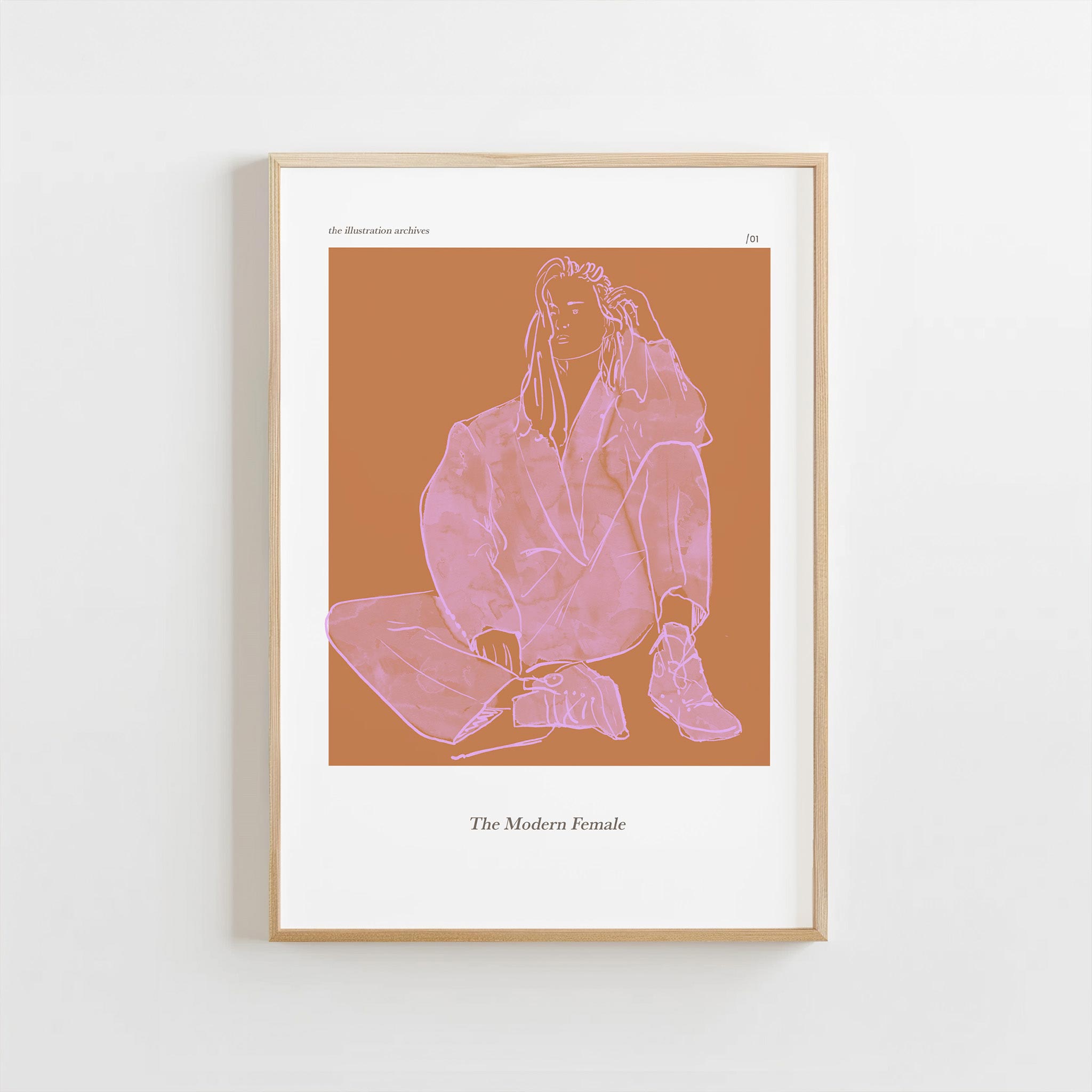 Framed artwork of a line drawing of a woman sitting on a bench with text 'The Modern Female' on a brown background.