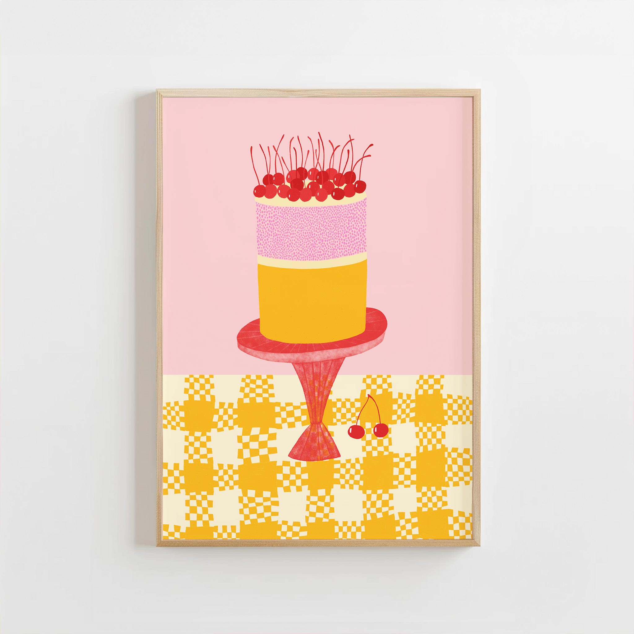 Framed artwork of a colorful cake illustration on a pink background