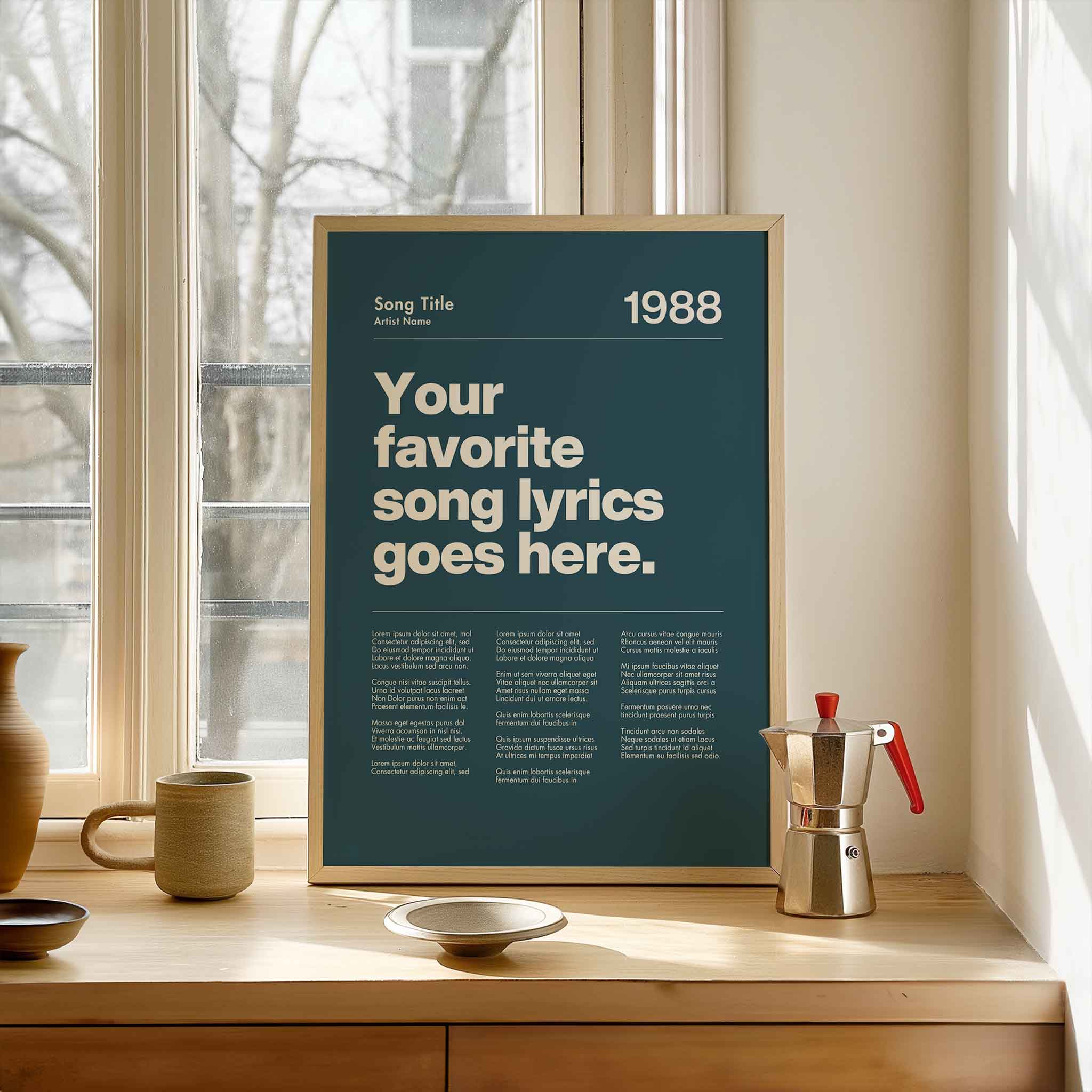 a poster on a window sill next to a cup and saucer