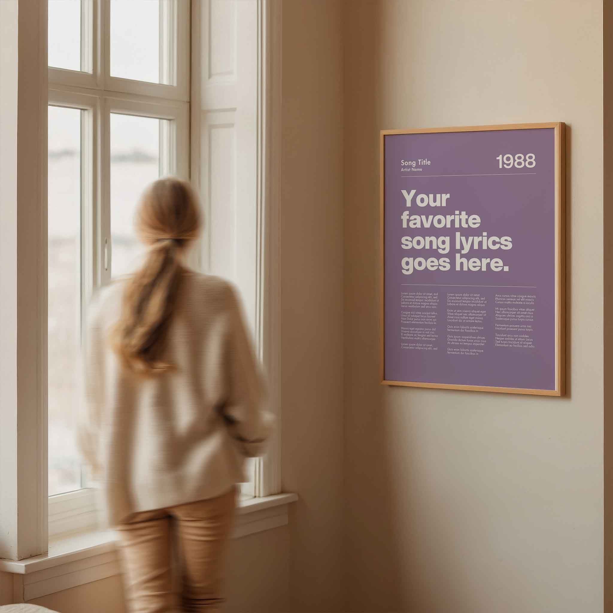 a woman looking out a window at a poster