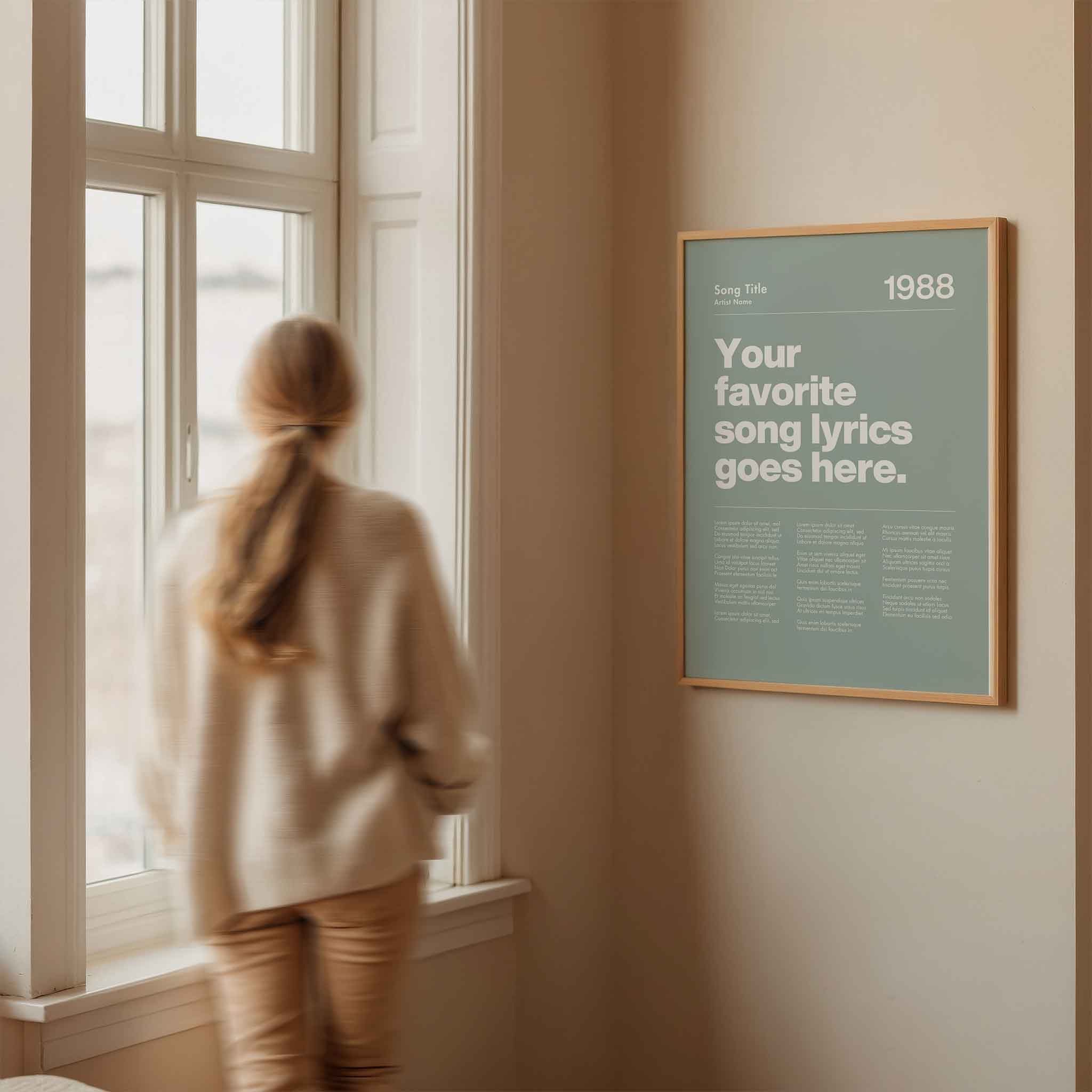 a woman looking out a window at a poster