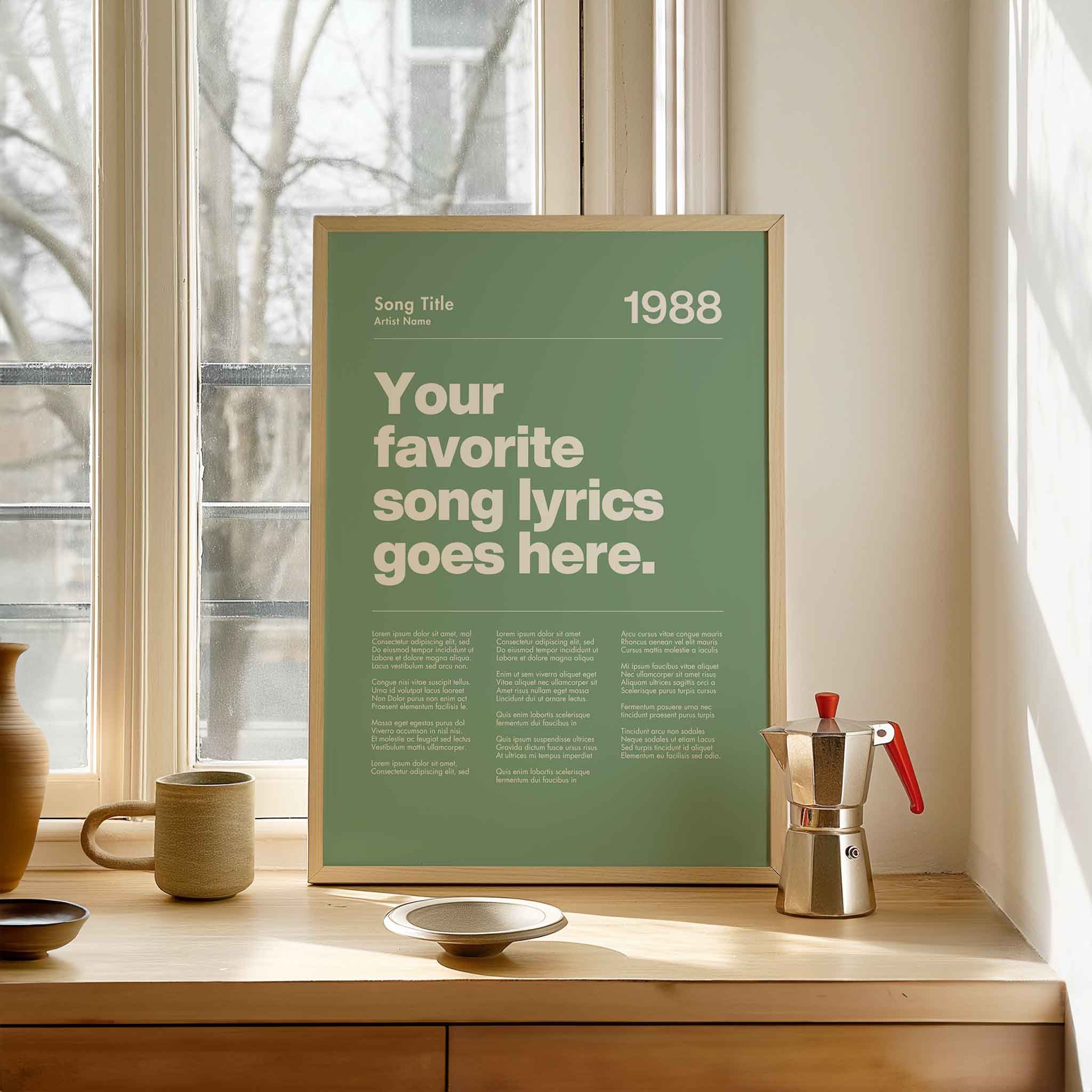 a poster on a window sill next to a cup and saucer