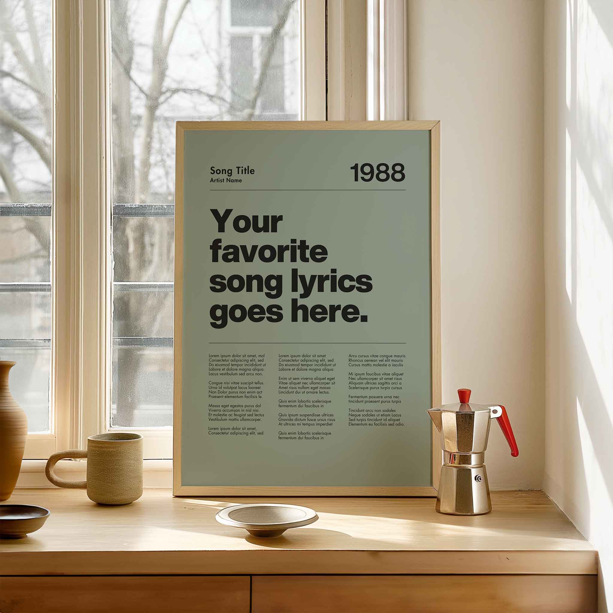 a poster on a window sill next to a cup and saucer