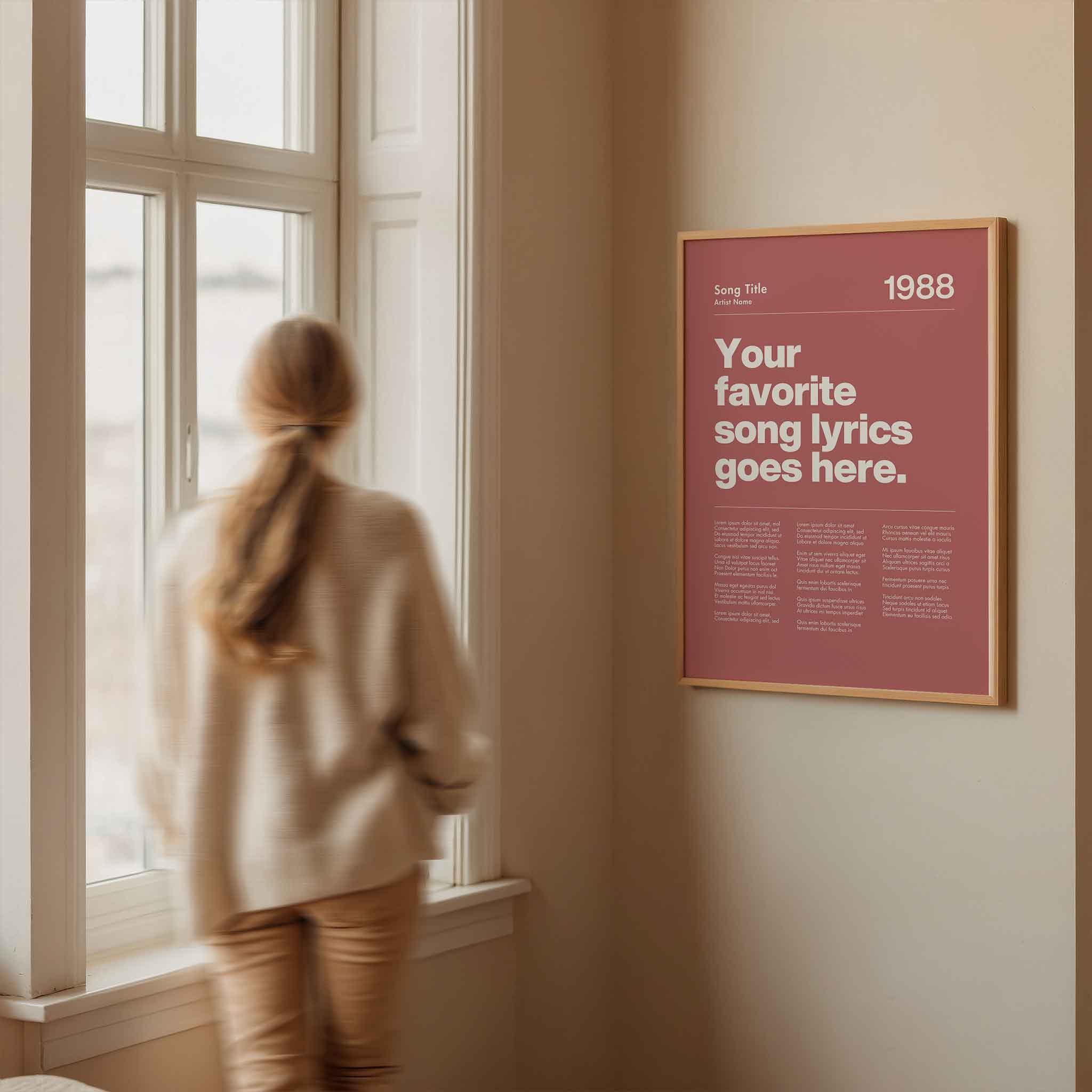 a woman looking out a window at a poster