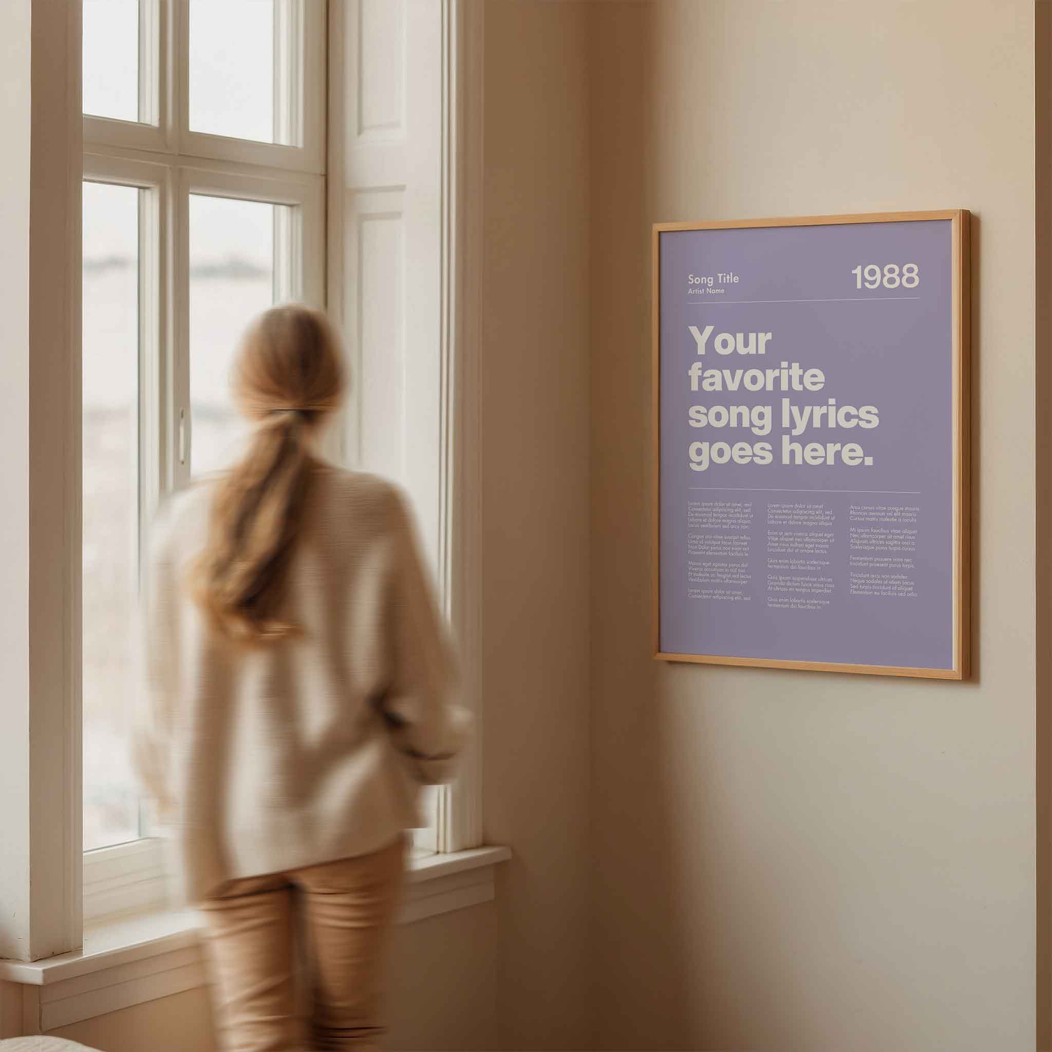 a woman looking out a window at a poster
