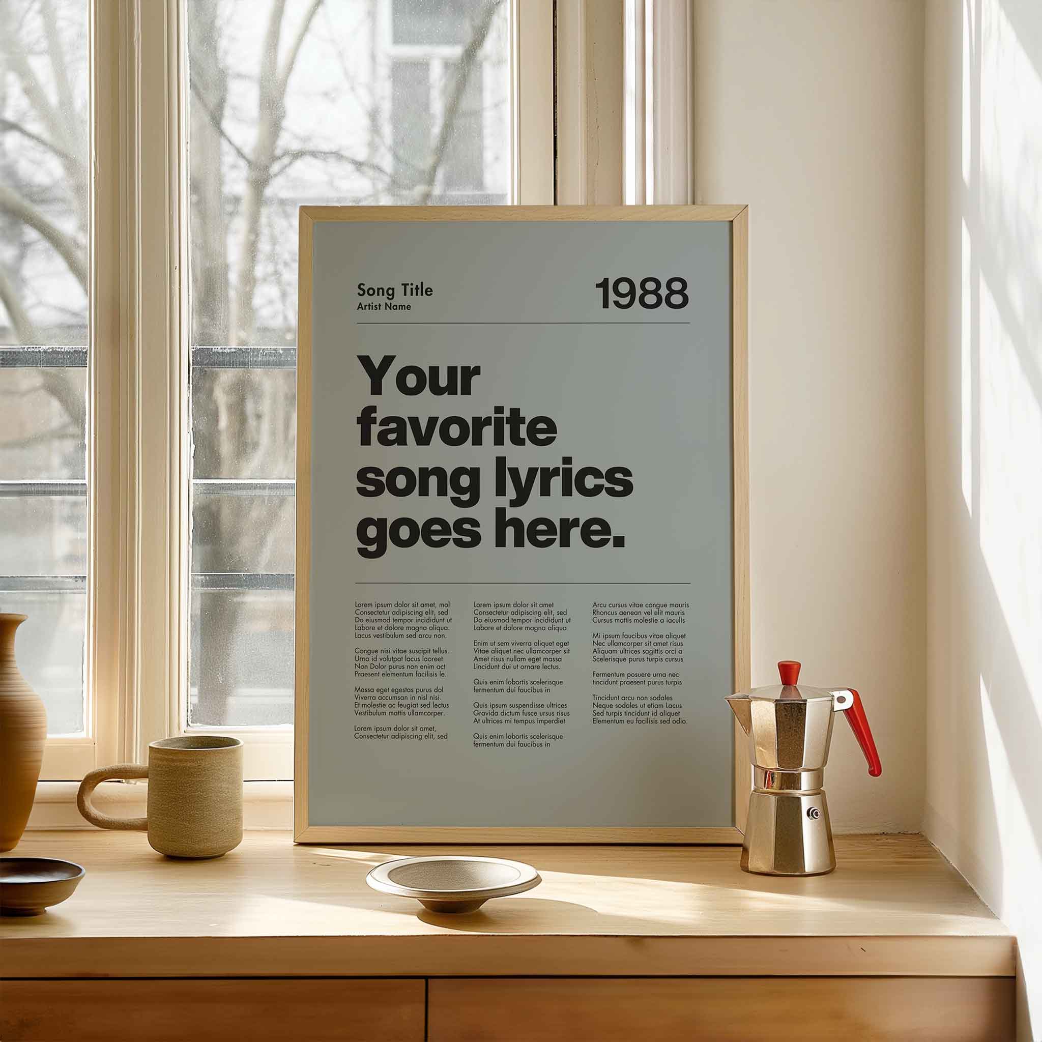 a poster on a window sill next to a cup and saucer