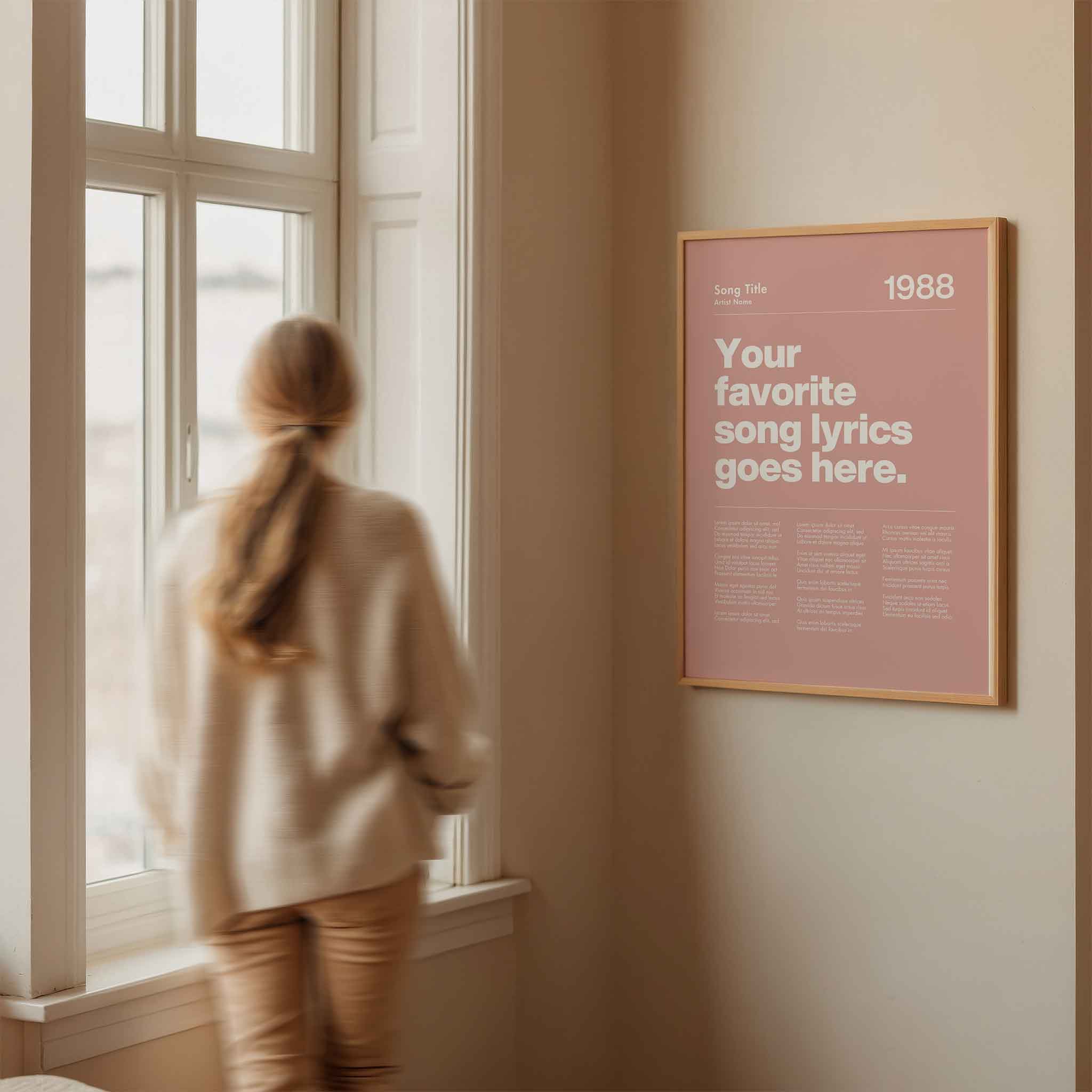 a woman looking out a window at a poster