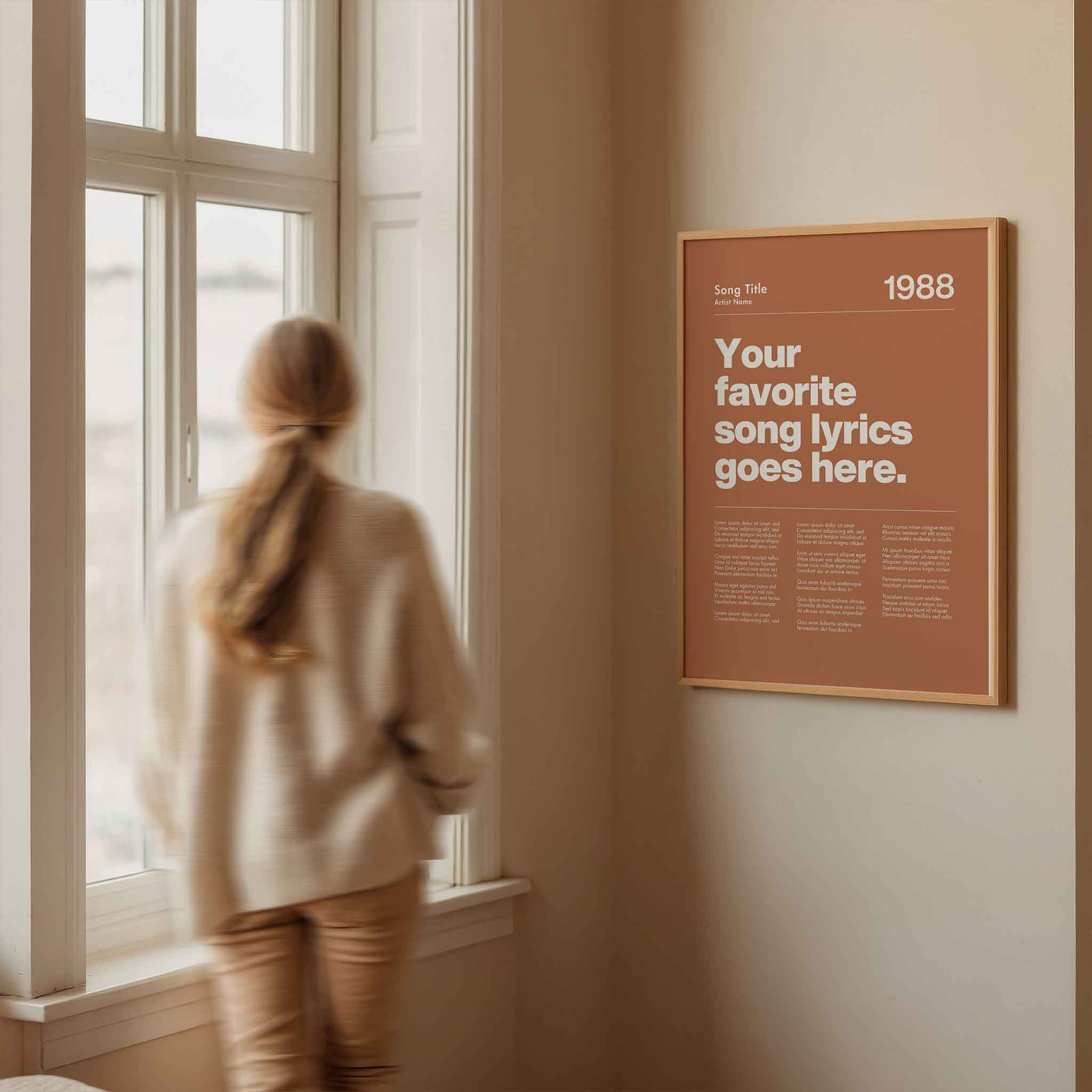 a woman looking out a window at a poster