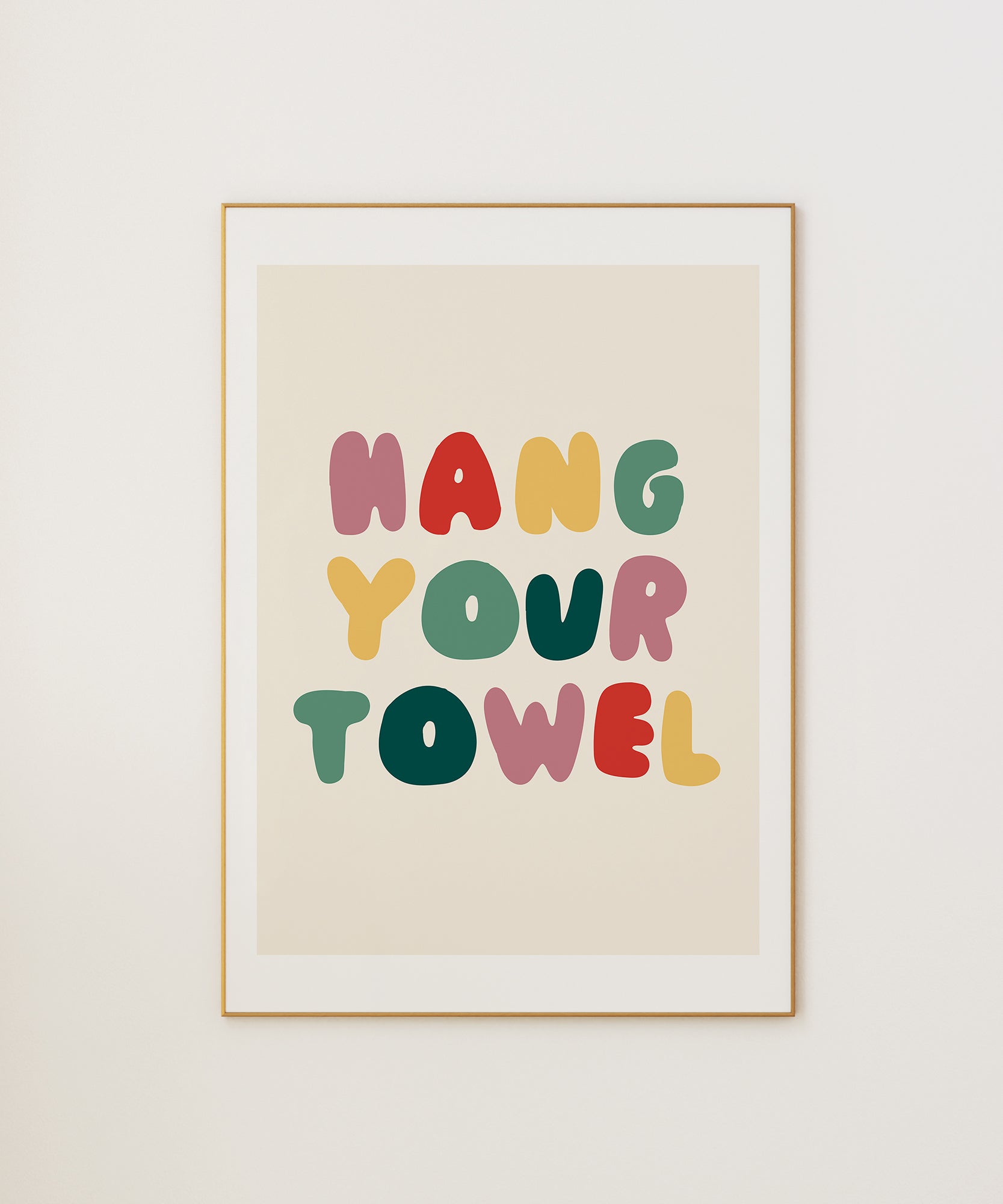 Hang Your Towel' playful typography, framed wall art prints for a humorous bathroom aesthetic.