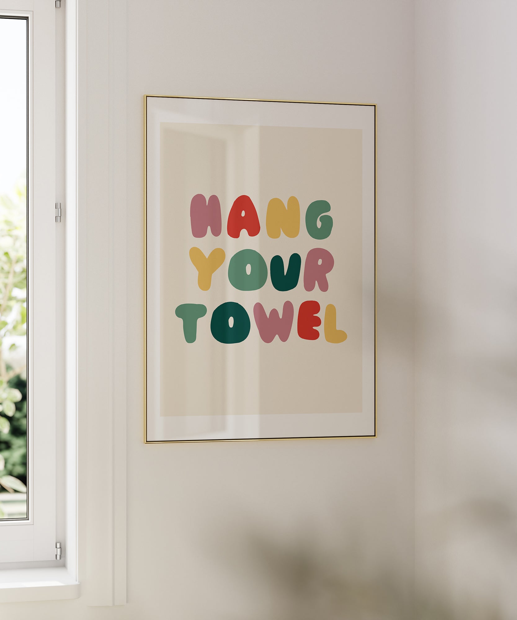 Hang Your Towel' playful typography, framed wall art prints for a humorous bathroom aesthetic.