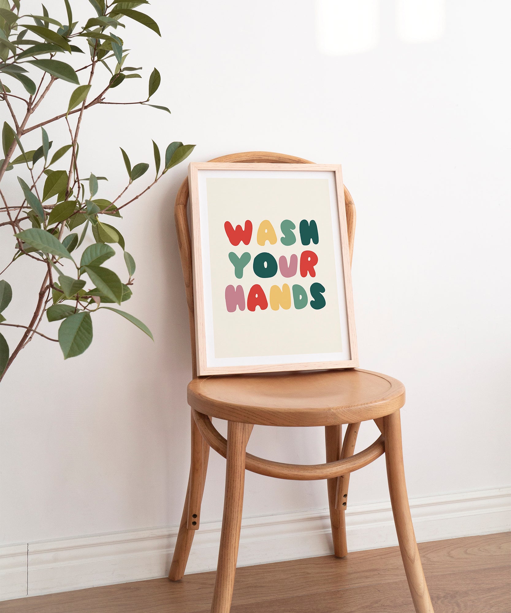 Wash Your Hands' playful typography, framed abstract prints for a humorous bathroom aesthetic.