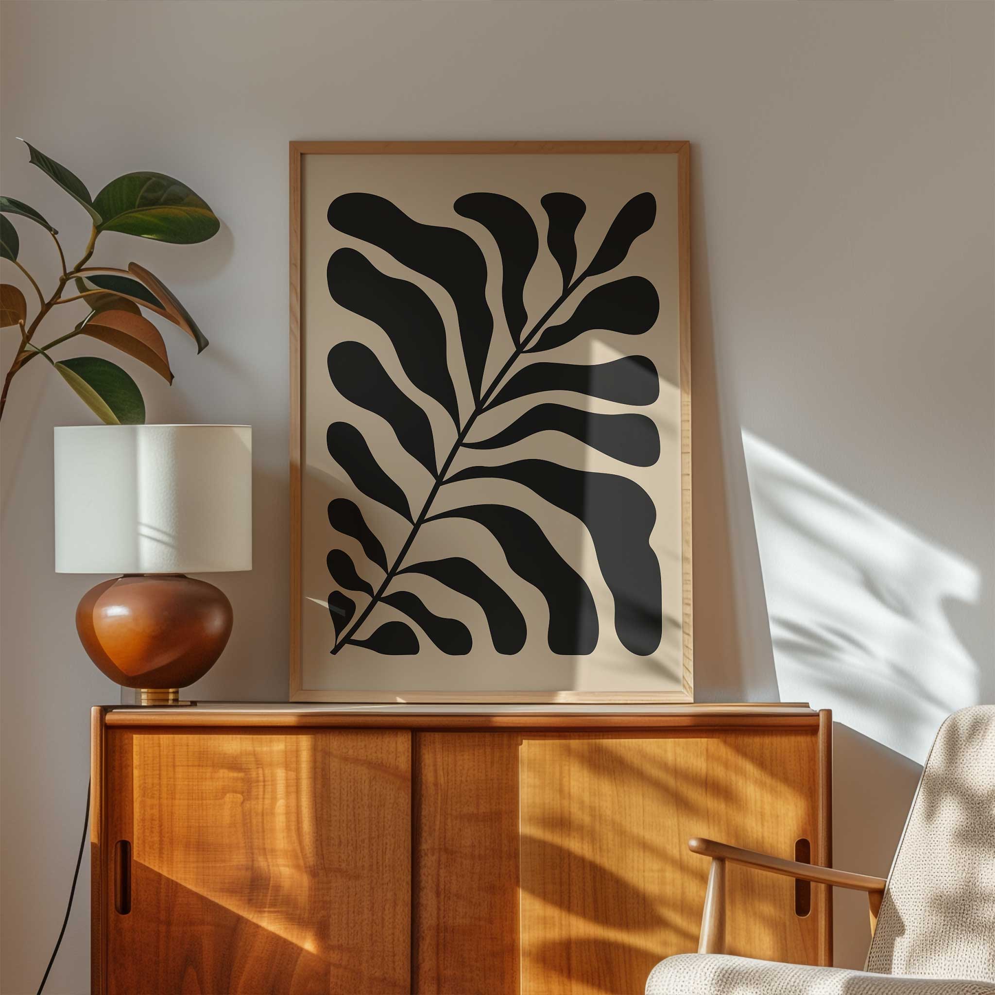 A bold, monochrome silhouette of a fern leaf on a light background, modern botanical art titled 'Night Fern'.