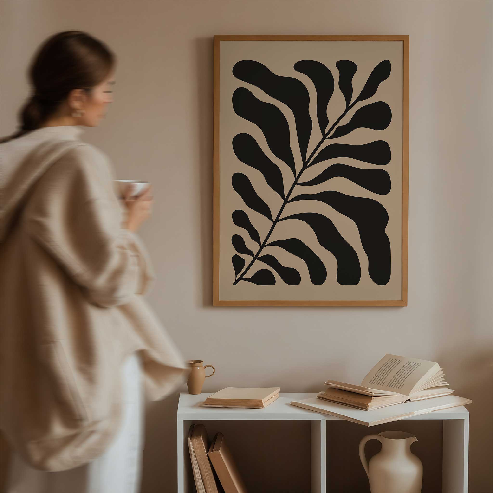 A bold, monochrome silhouette of a fern leaf on a light background, modern botanical art titled 'Night Fern'.