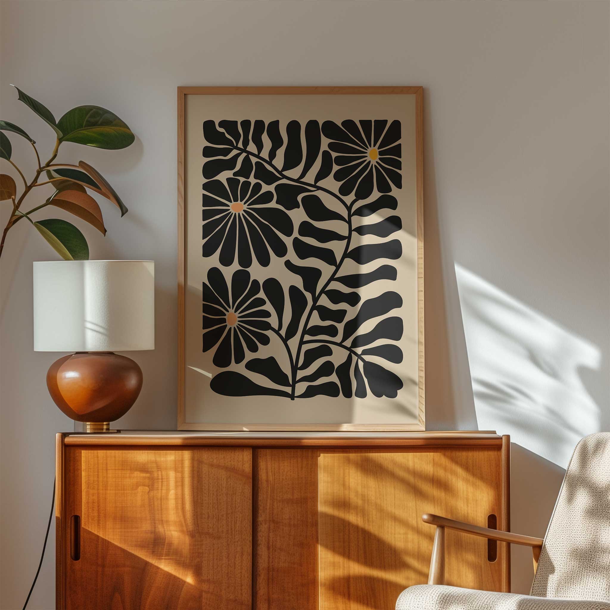 Modern floral art print featuring three daisy-like sunburst blooms against dark foliage.
