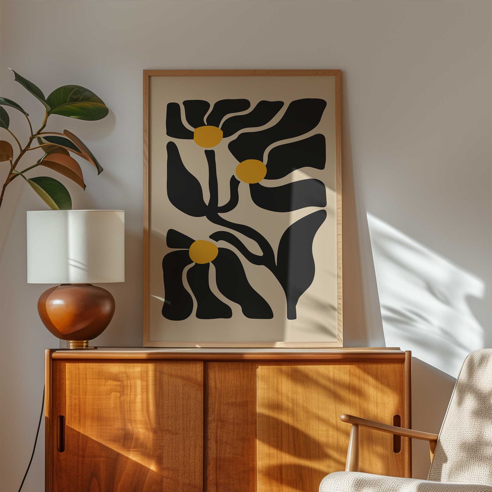 An expressive minimalist print of three abstract golden floral blossoms on flowing stems.