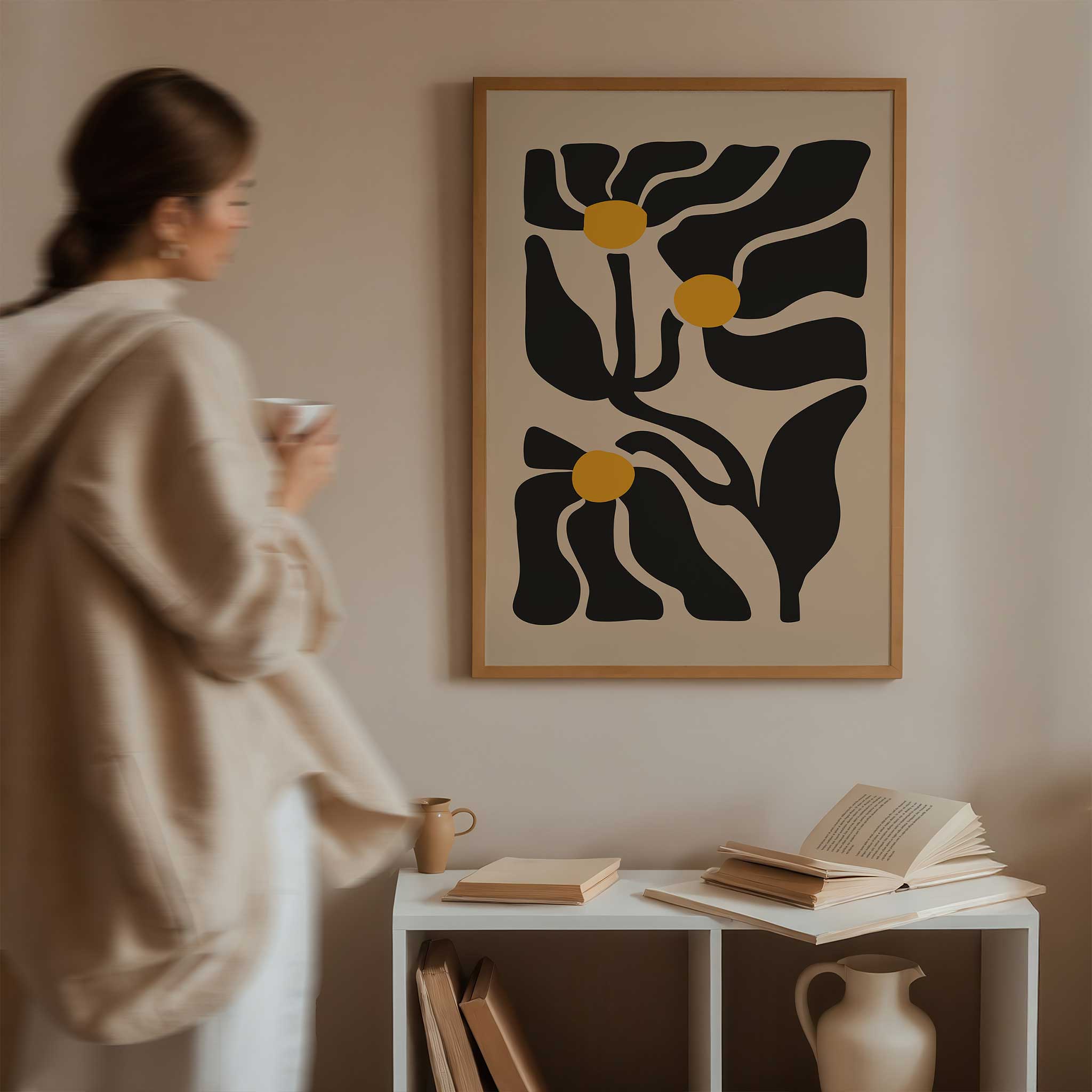 An expressive minimalist print of three abstract golden floral blossoms on flowing stems.