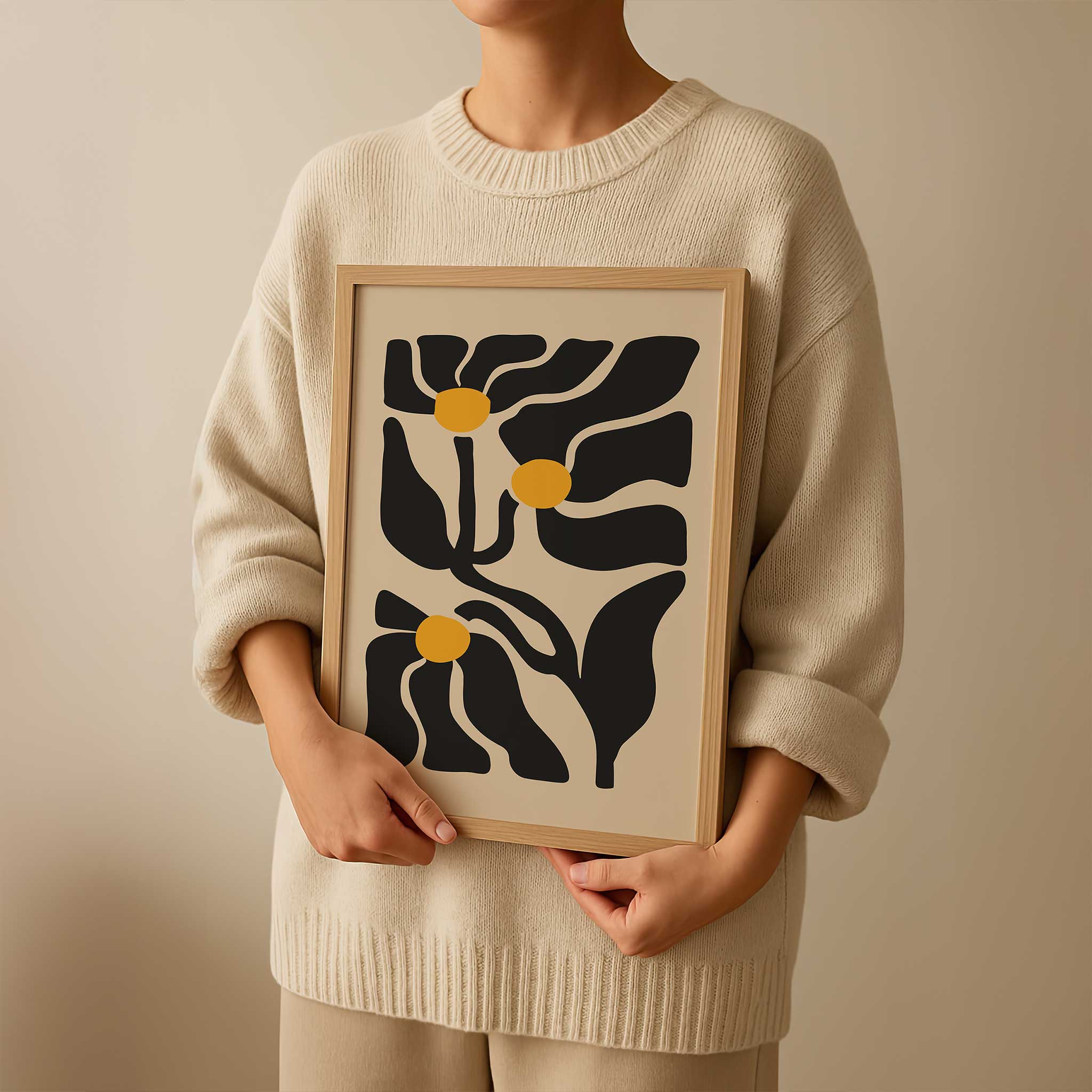 An expressive minimalist print of three abstract golden floral blossoms on flowing stems.