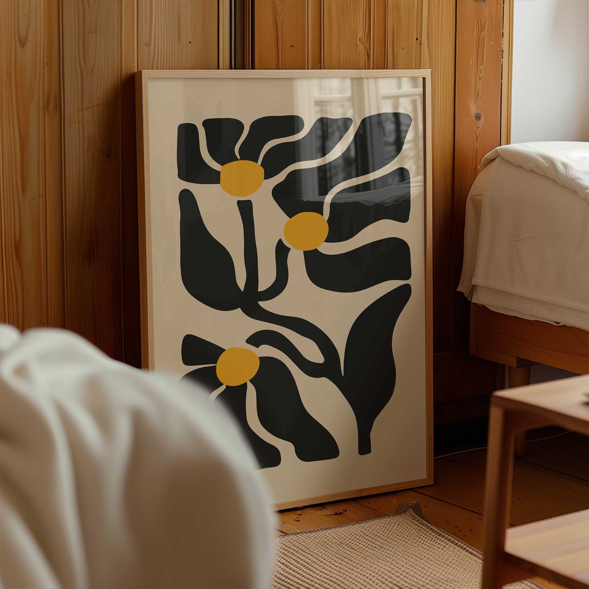 An expressive minimalist print of three abstract golden floral blossoms on flowing stems.