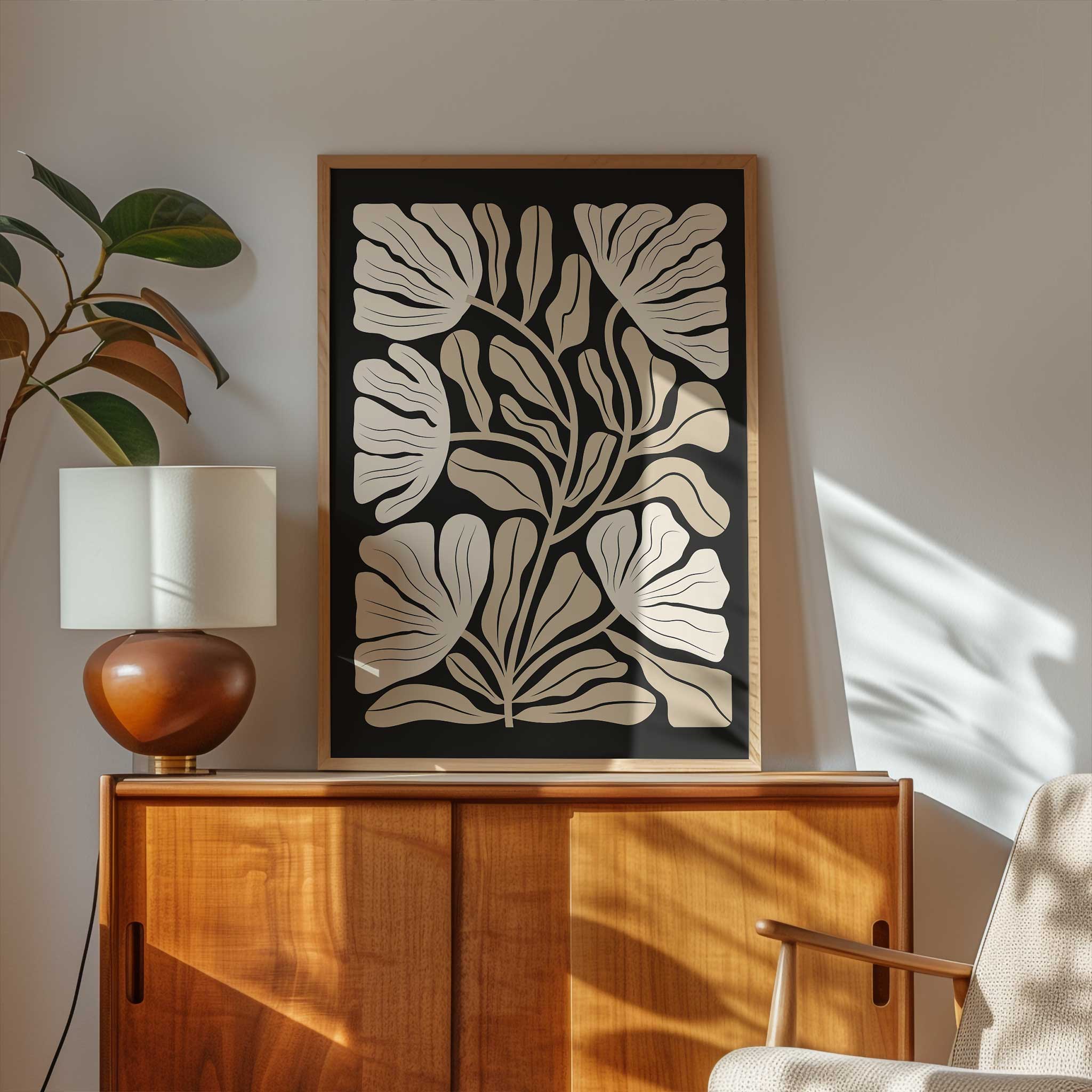 An elegant minimalist print of overlapping ginkgo leaves in warm neutral and beige tones.