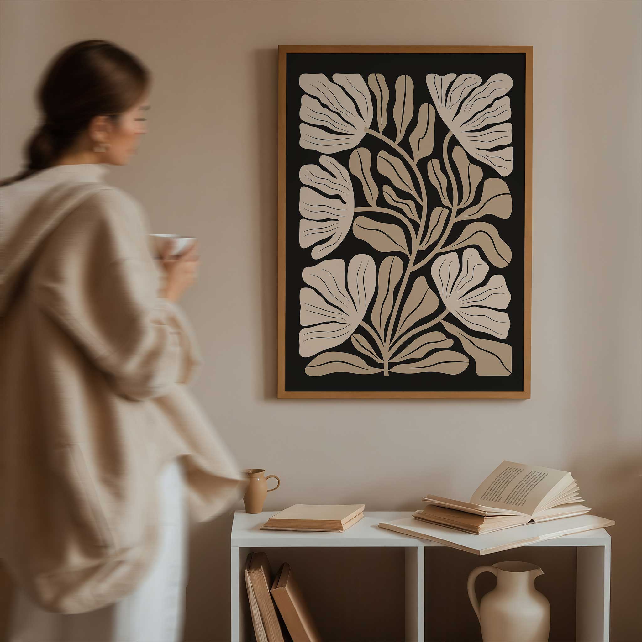 An elegant minimalist print of overlapping ginkgo leaves in warm neutral and beige tones.