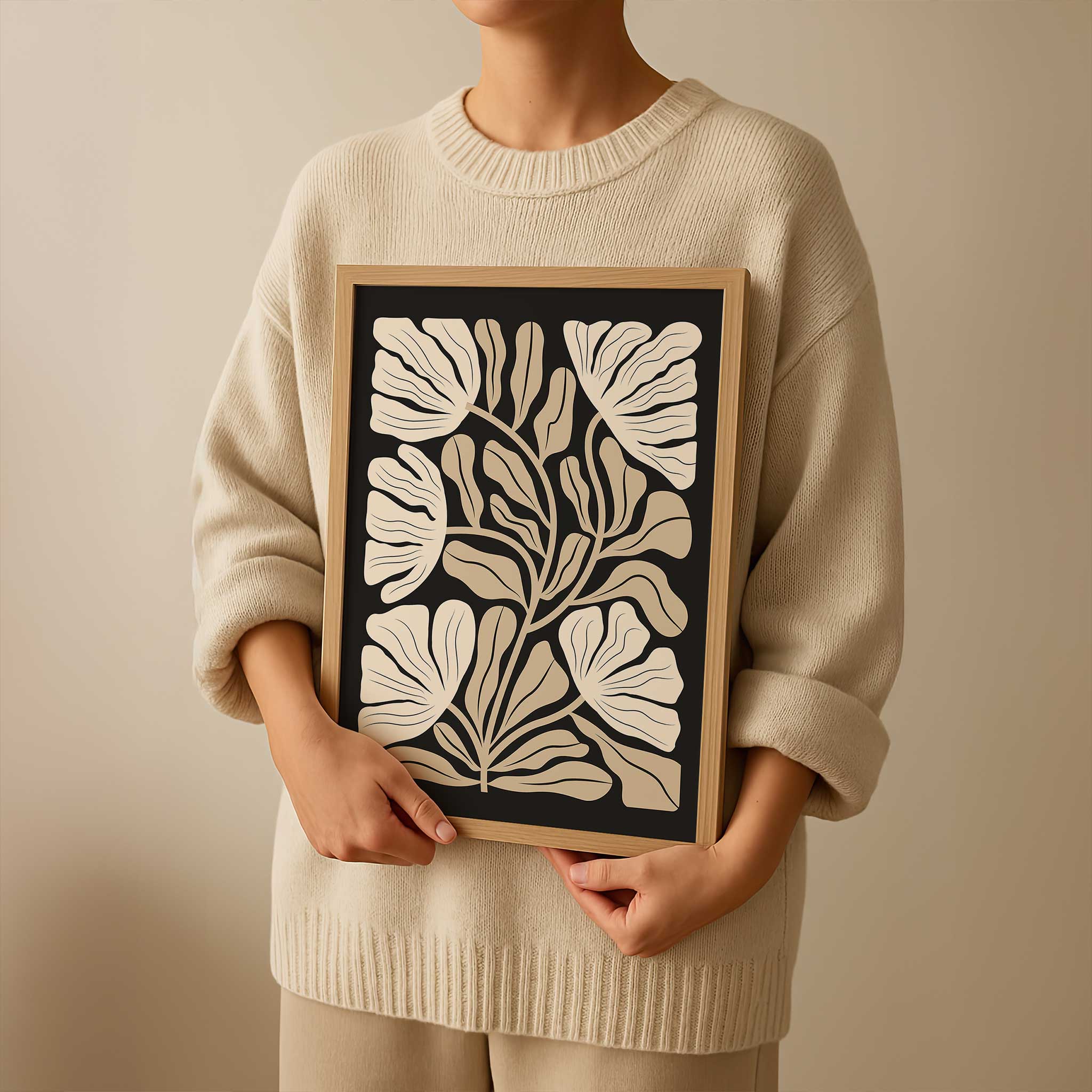 An elegant minimalist print of overlapping ginkgo leaves in warm neutral and beige tones.
