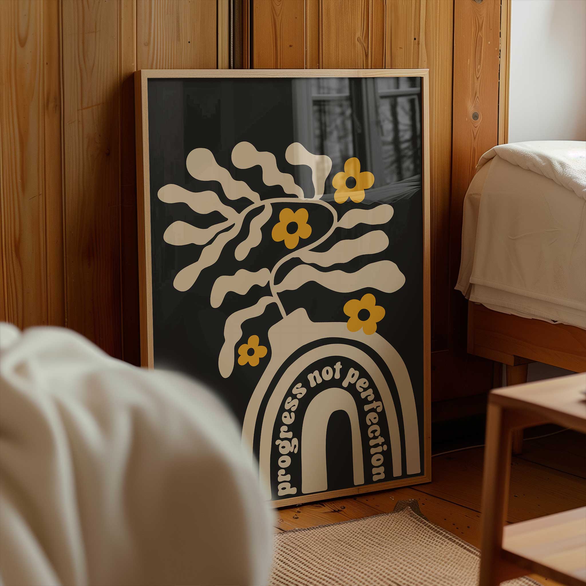 A motivational print blending playful floral shapes and a retro vase with the quote 'Progress Not Perfection'.
