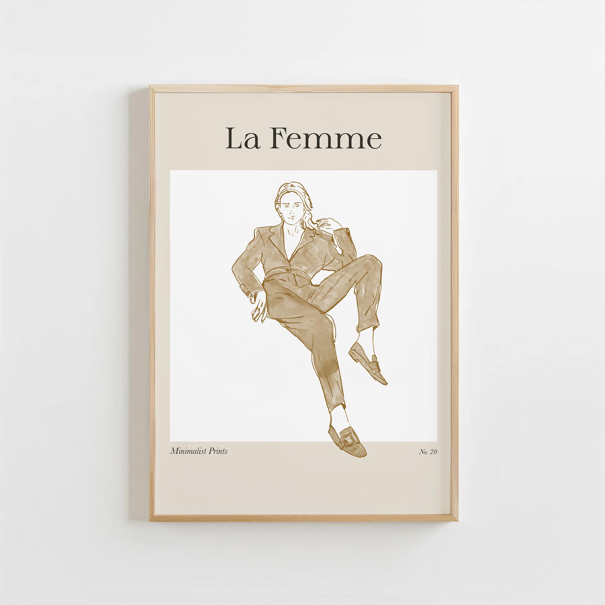 Framed artwork of a woman in a suit with 'La Femme' text on a beige background