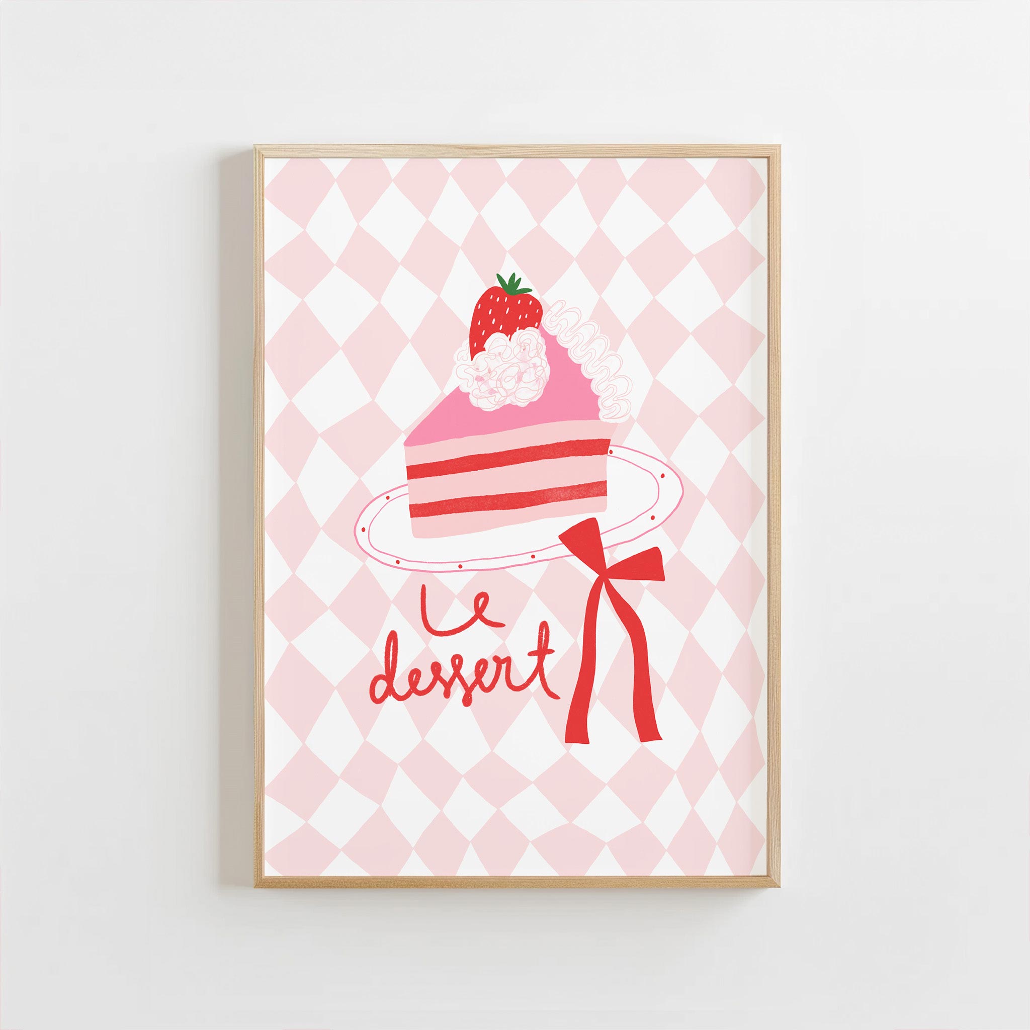 Framed artwork of a pink cake with a strawberry on a checkered background